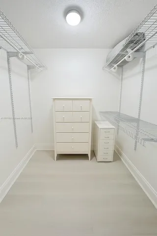 a view of an empty walk in closet