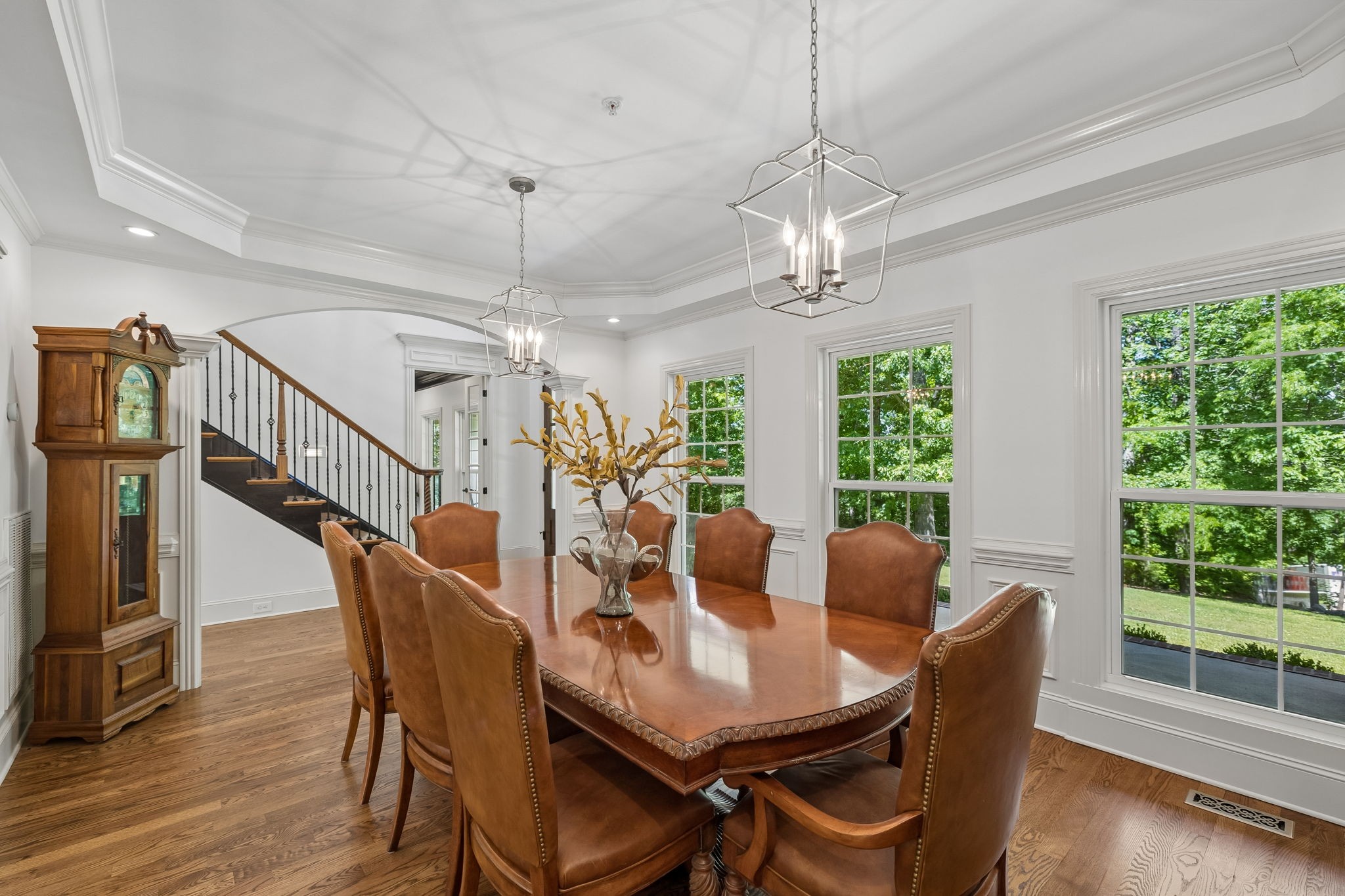 911 Bluff Road Brentwood, TN 37027 - Photo 11 of 61 a dining room with furniture a chandelier and wooden floor