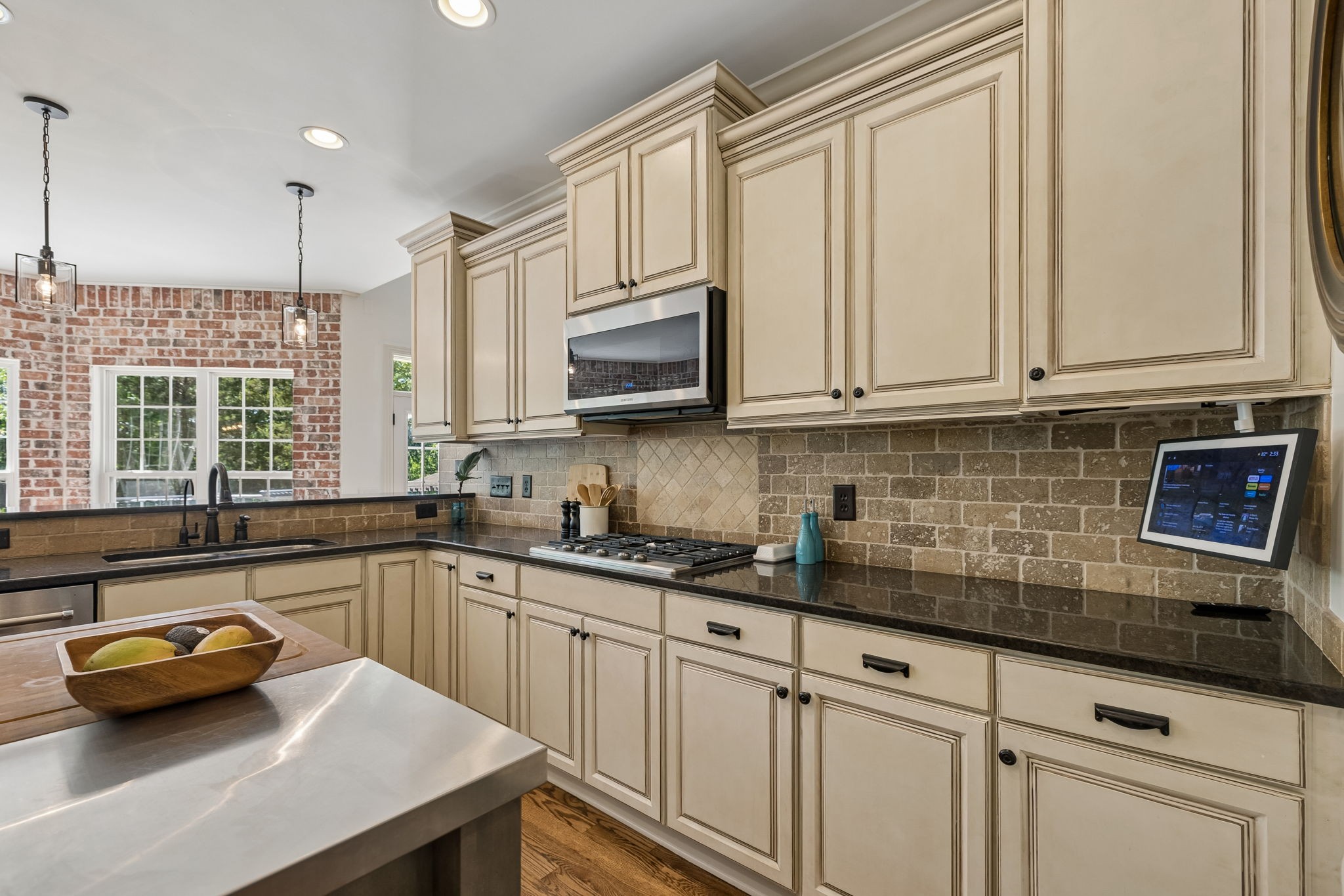 911 Bluff Road Brentwood, TN 37027 - Photo 13 of 61 a kitchen with stainless steel appliances granite countertop a sink a stove and a microwave