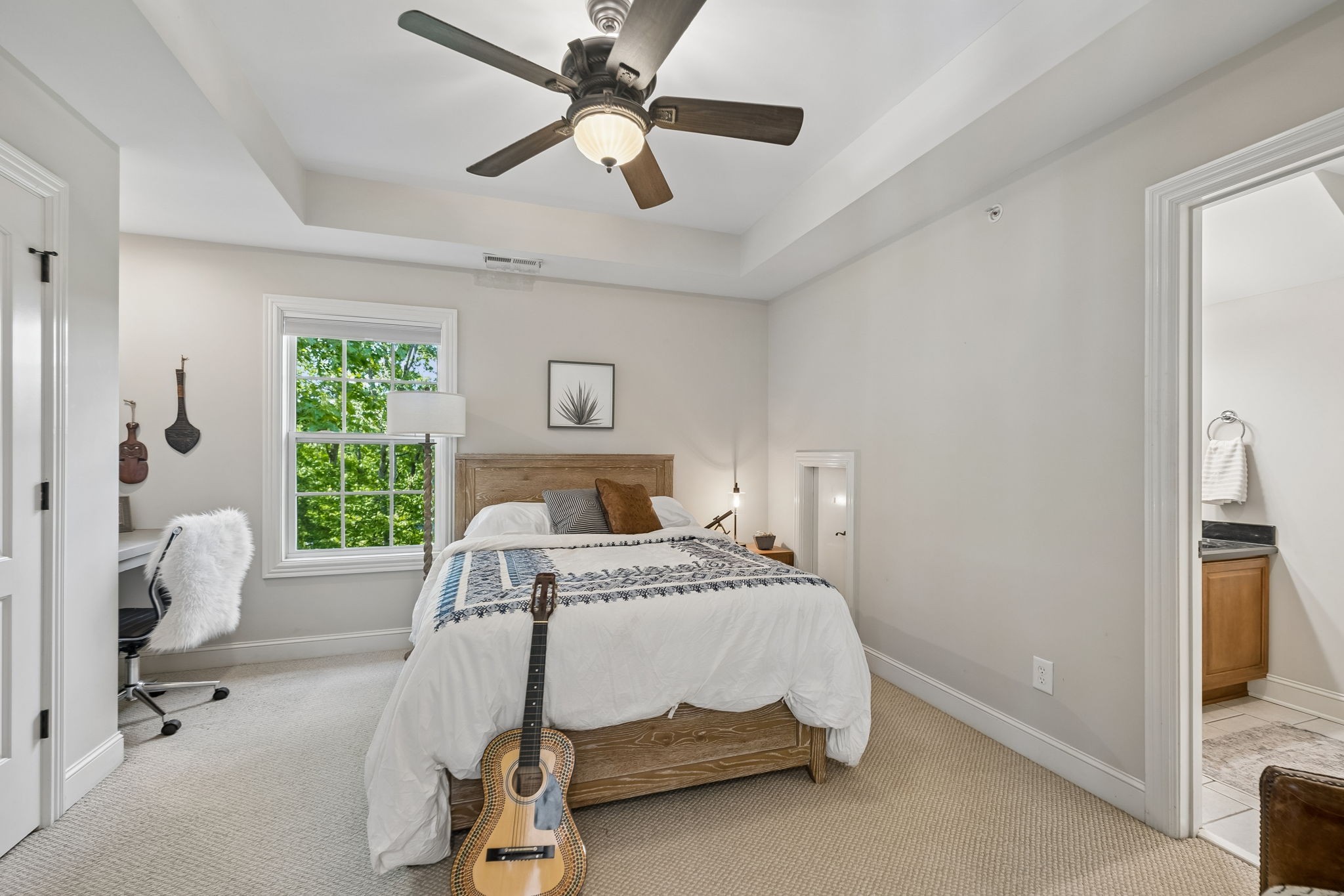 911 Bluff Road Brentwood, TN 37027 - Photo 22 of 61 a bedroom with a bed and a chandelier