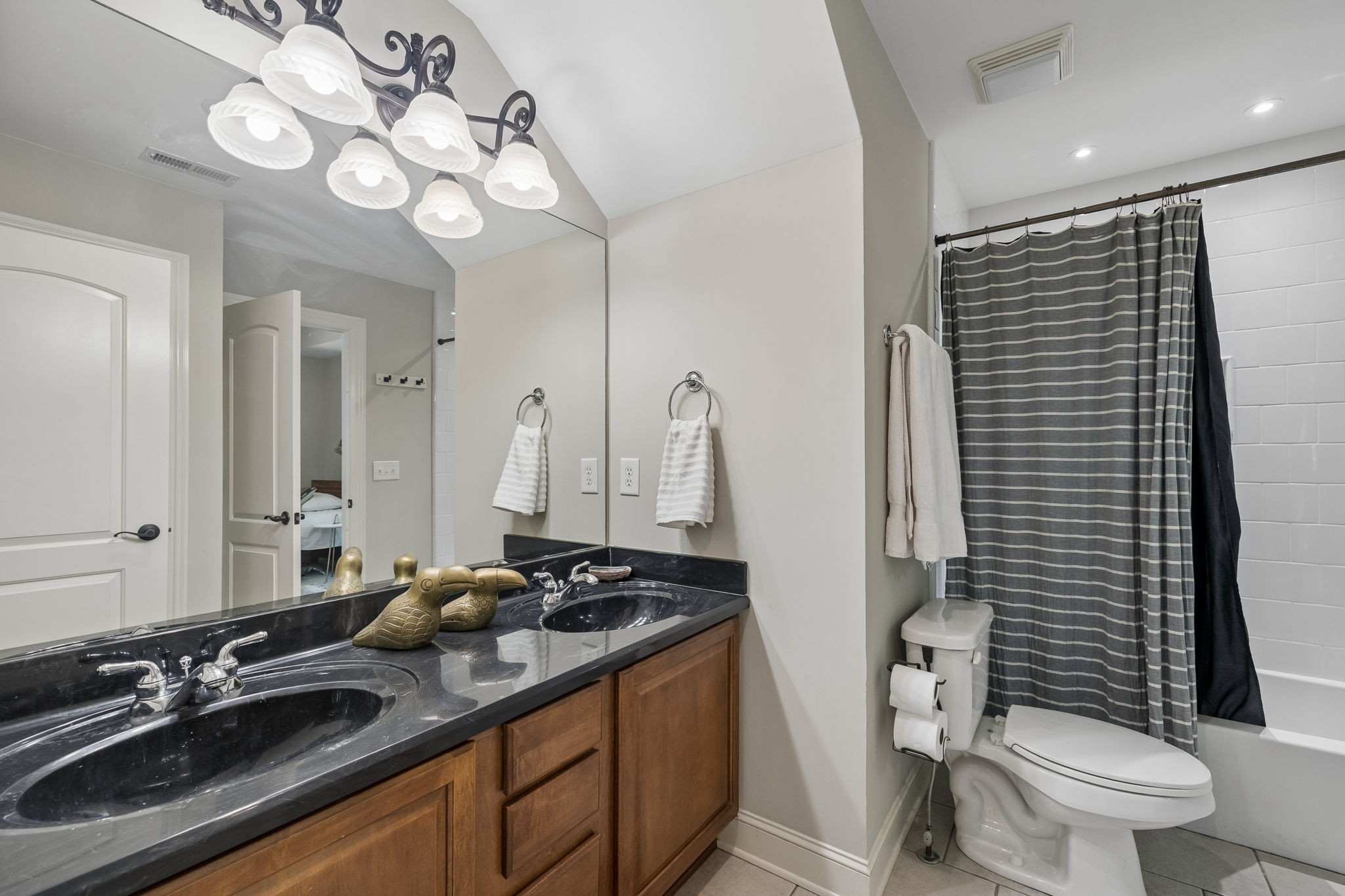 911 Bluff Road Brentwood, TN 37027 - Photo 24 of 61 a bathroom with a double vanity sink mirror and toilet