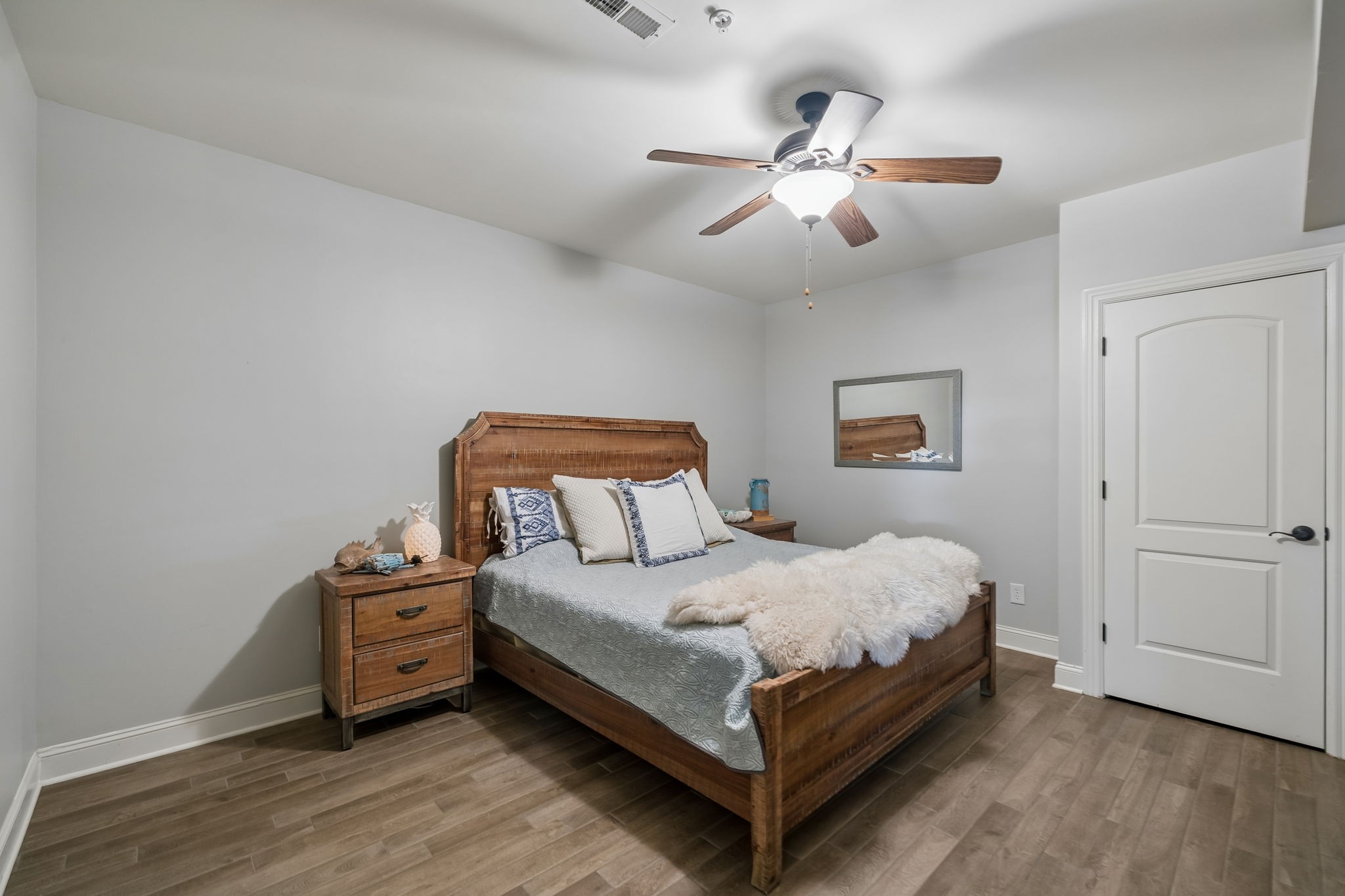 911 Bluff Road Brentwood, TN 37027 - Photo 41 of 61 a bedroom with a bed and a chandelier