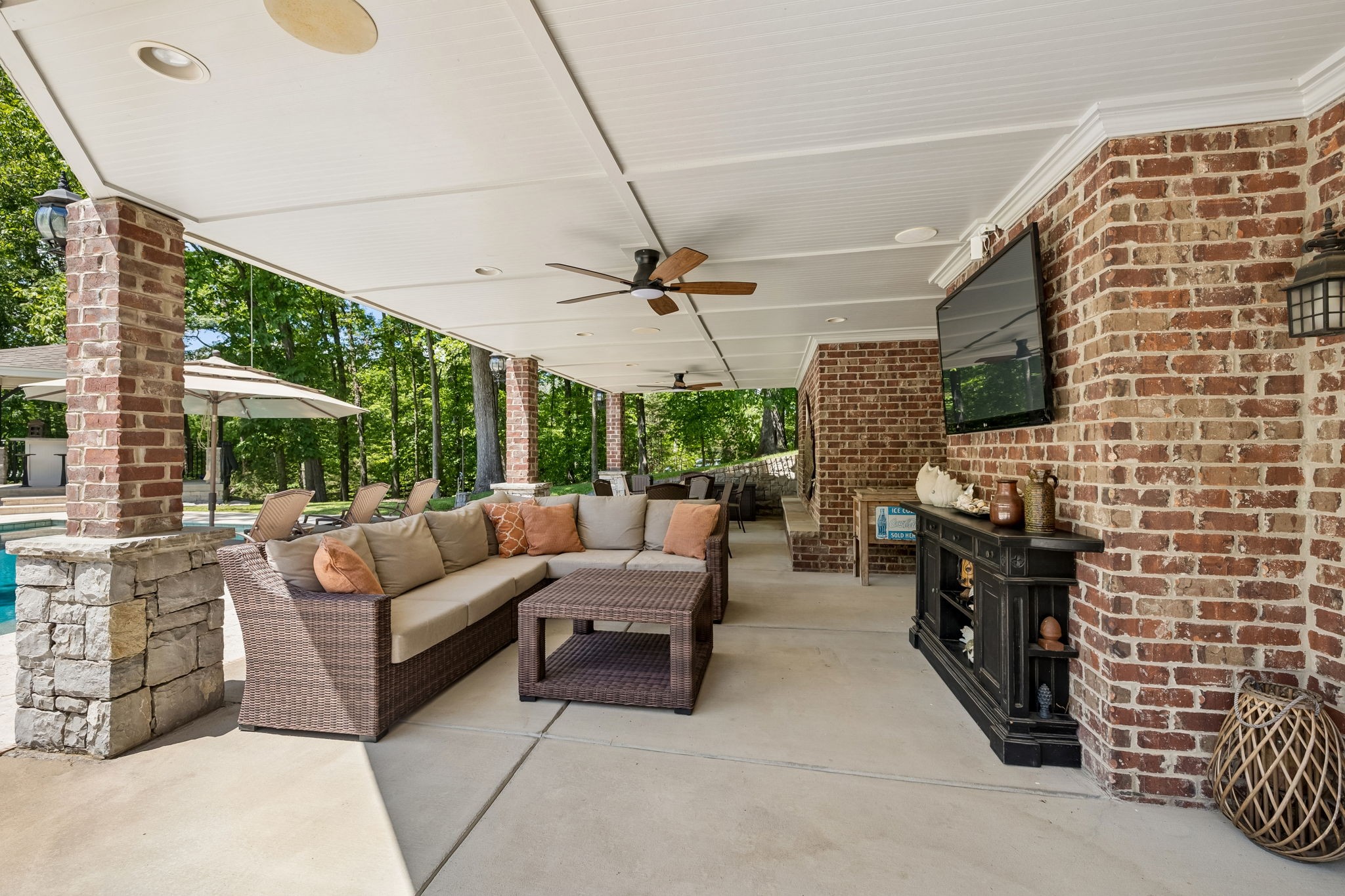 911 Bluff Road Brentwood, TN 37027 - Photo 48 of 61 a living room with patio furniture and a flat screen tv