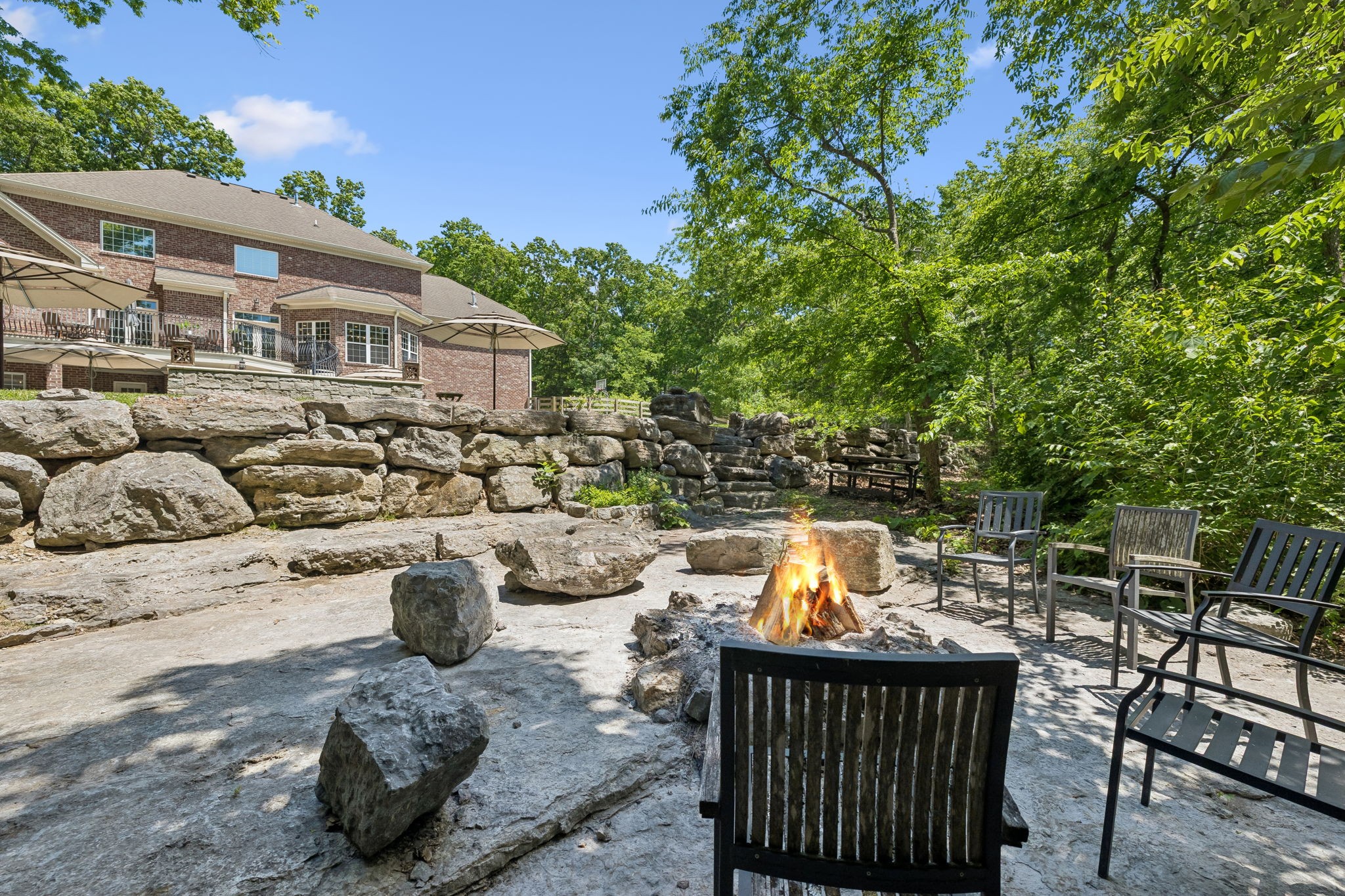 911 Bluff Road Brentwood, TN 37027 - Photo 51 of 61 a view of a patio with couches table and chairs and potted plants
