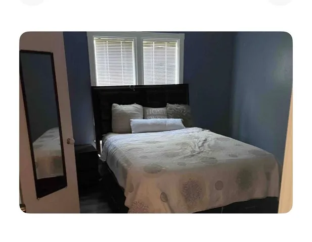a black and white photo of a living room
