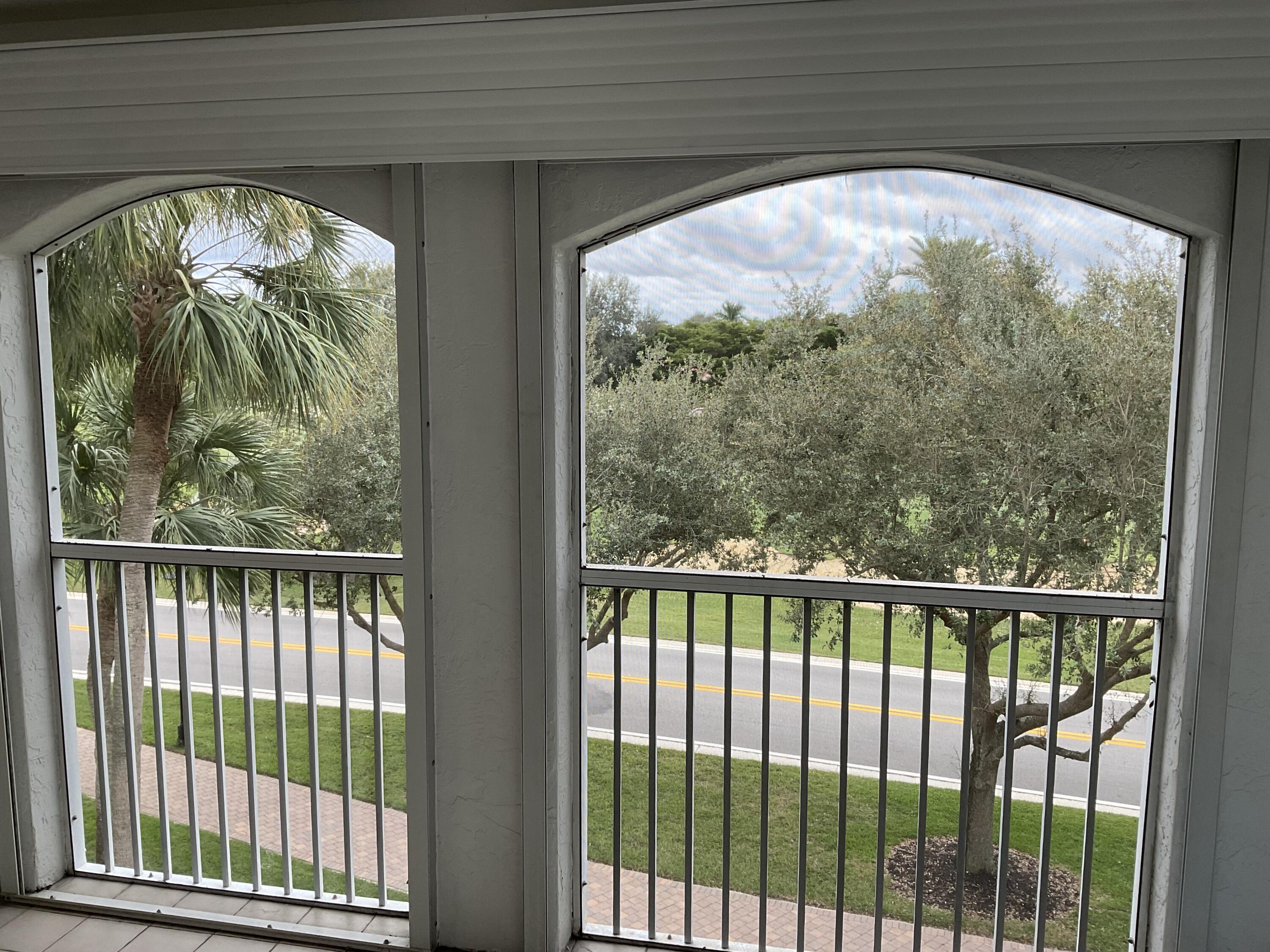 7370 Orangewood Lane, Unit 303 Boca Raton, FL 33433 - Photo 27 of 45 a view of a large window with an outdoor space