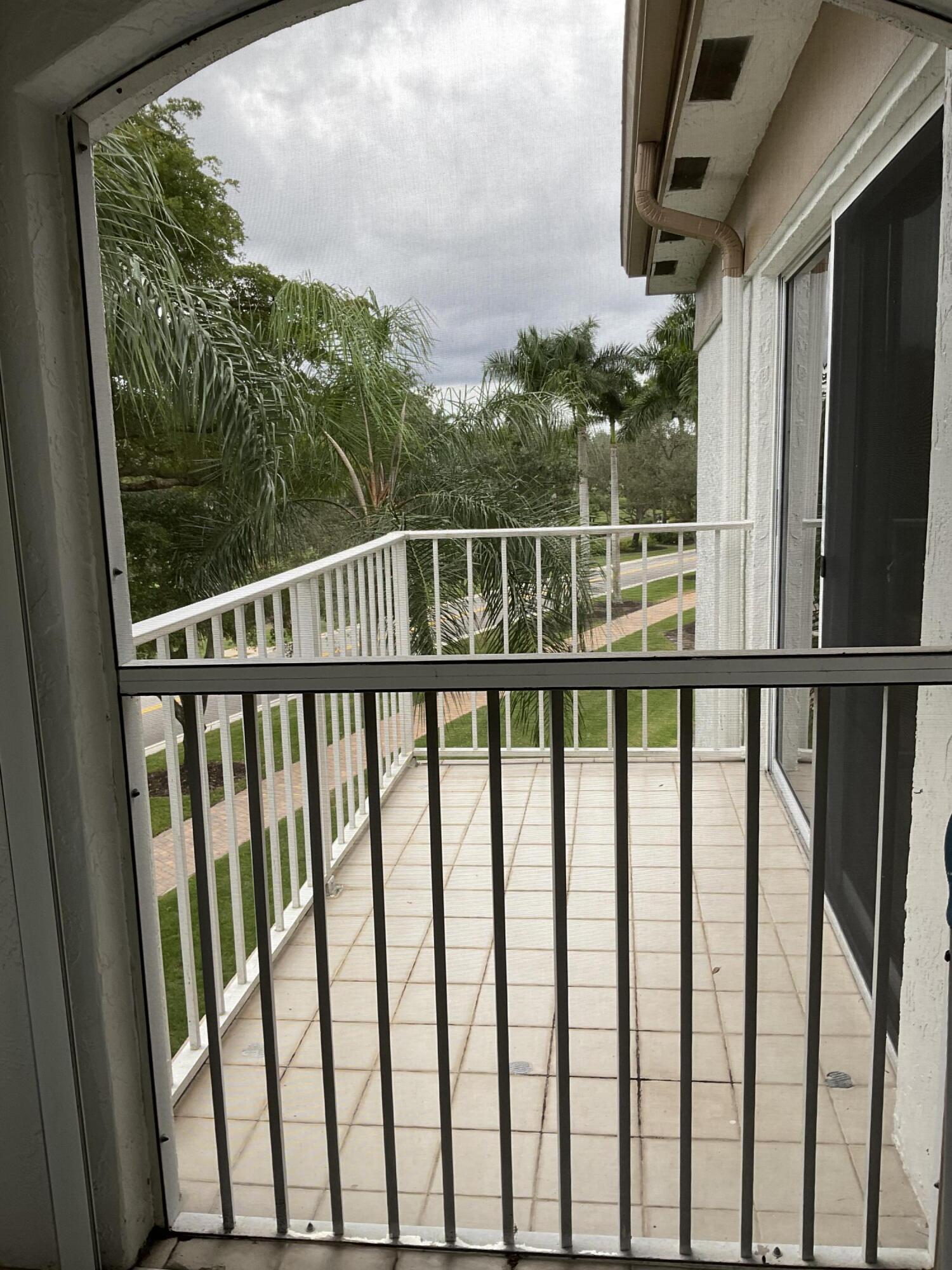 7370 Orangewood Lane, Unit 303 Boca Raton, FL 33433 - Photo 29 of 45 a view of a balcony