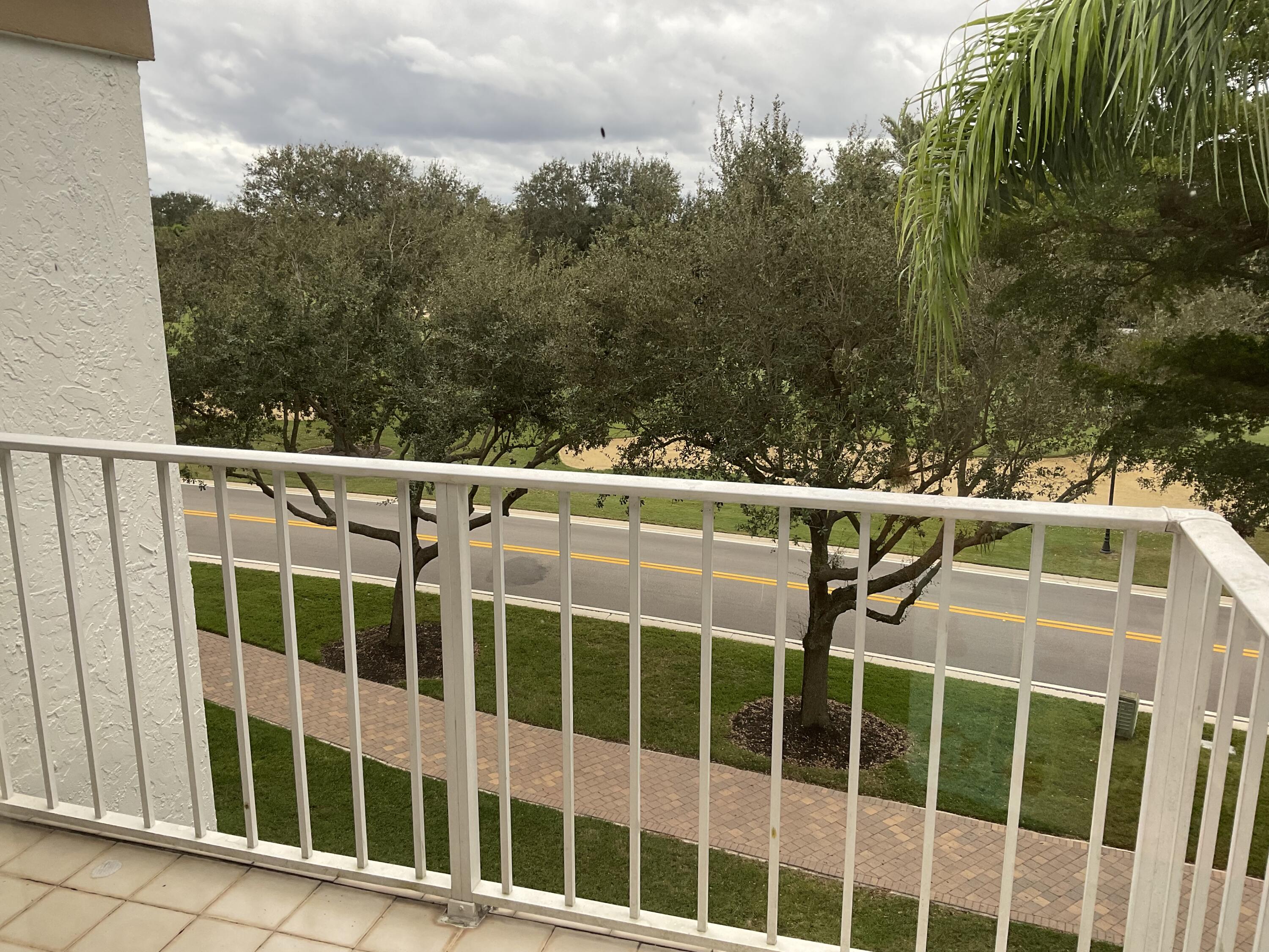 7370 Orangewood Lane, Unit 303 Boca Raton, FL 33433 - Photo 30 of 45 a view of a balcony with yard