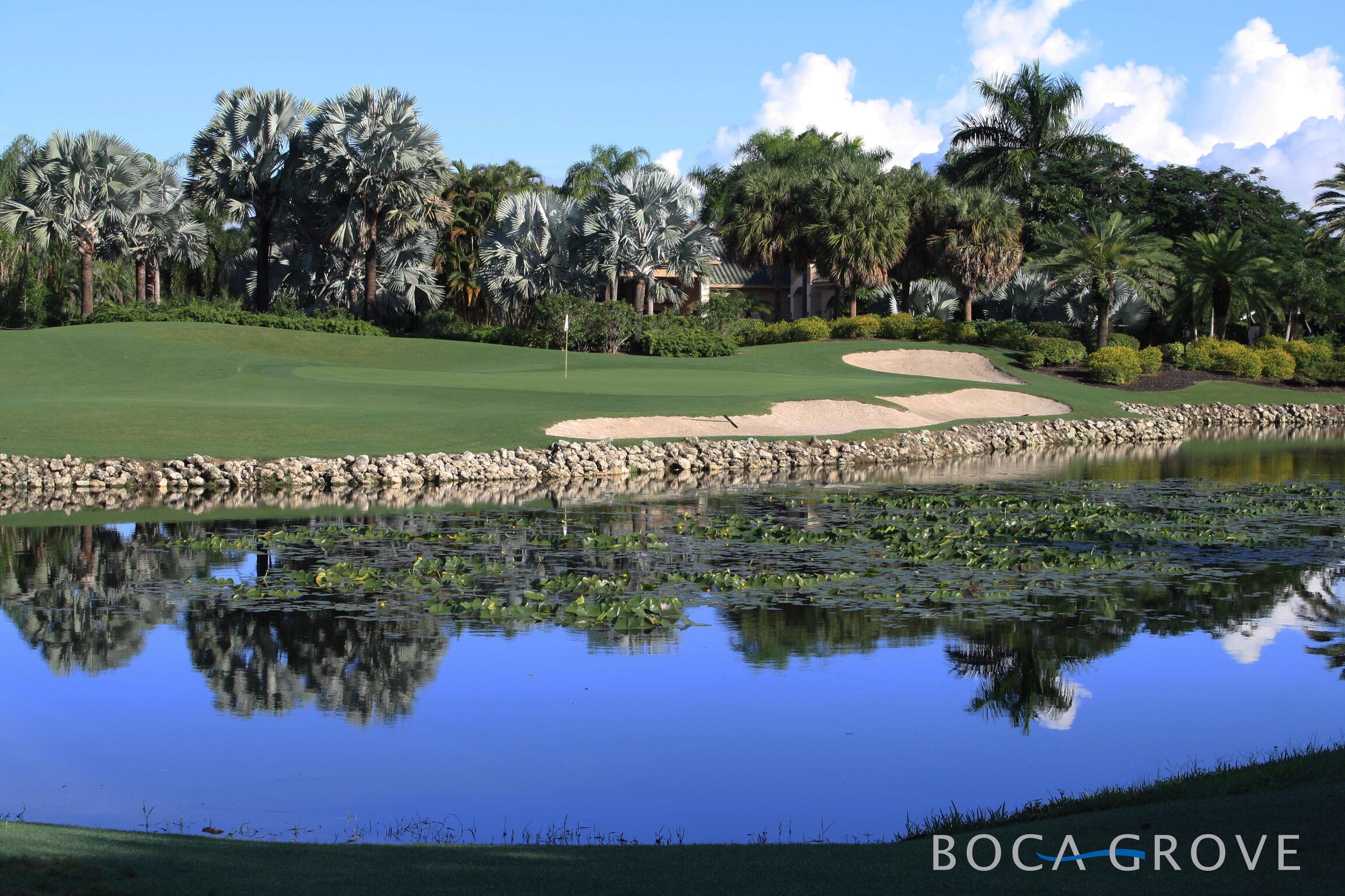 7370 Orangewood Lane, Unit 303 Boca Raton, FL 33433 - Photo 4 of 45 a view of a lake from a yard
