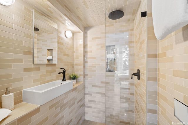 a bathroom with a bathtub and a shower