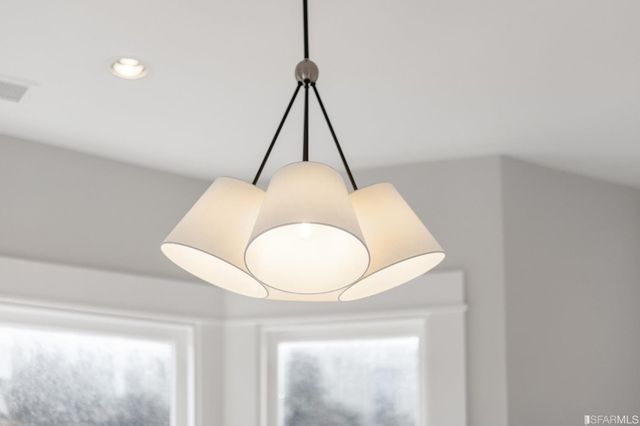 a room that has a wooden floor and a plant in it