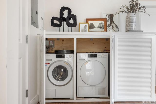 a bathroom with a washer and dryer