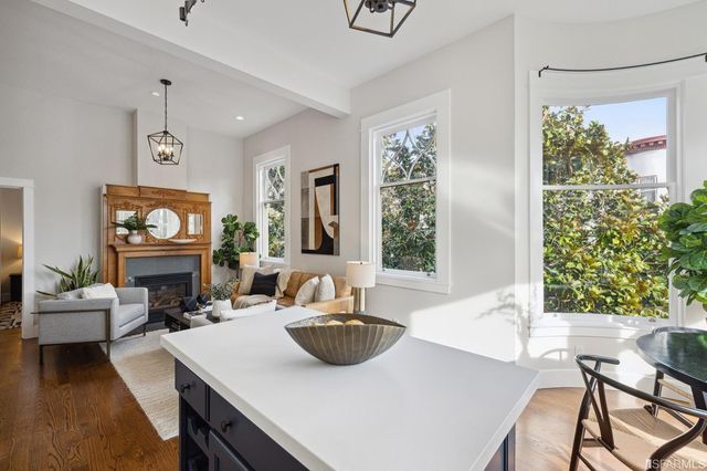 a view of a dining room with furniture window and outside view