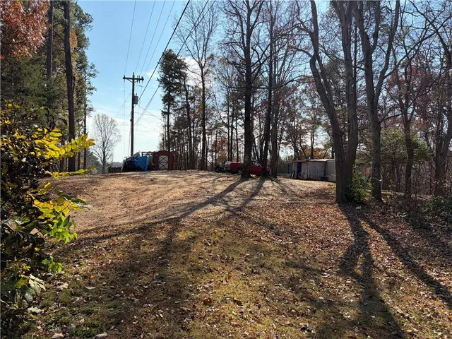 a view of a yard with trees