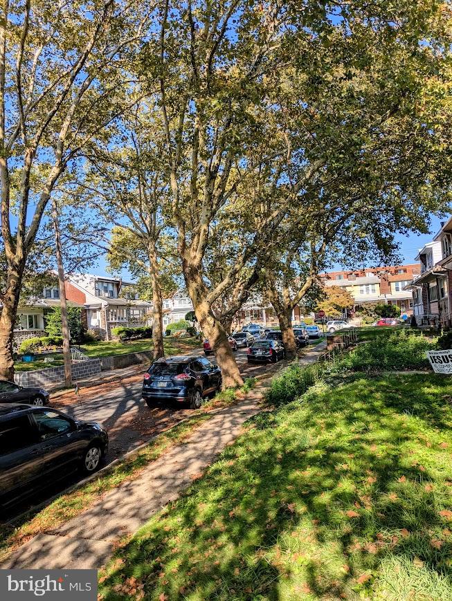817 Passmore Street Philadelphia, PA 19111 - Photo 4 of 16 a view of a yard with cars parked on the roadside