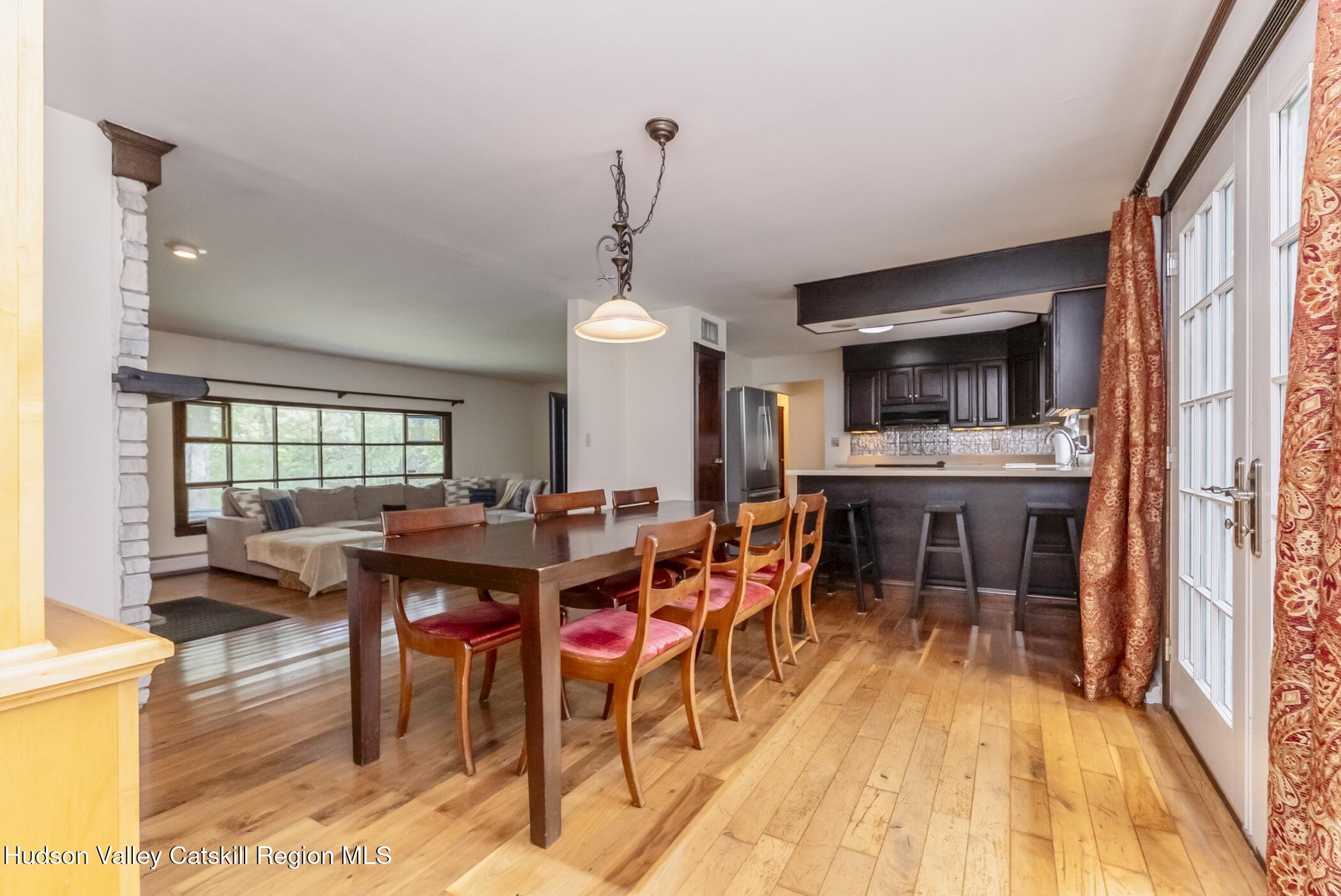 137 Bush Road Stone Ridge, NY 12484 - Photo 13 of 39 a view of a dining hall with furniture and window