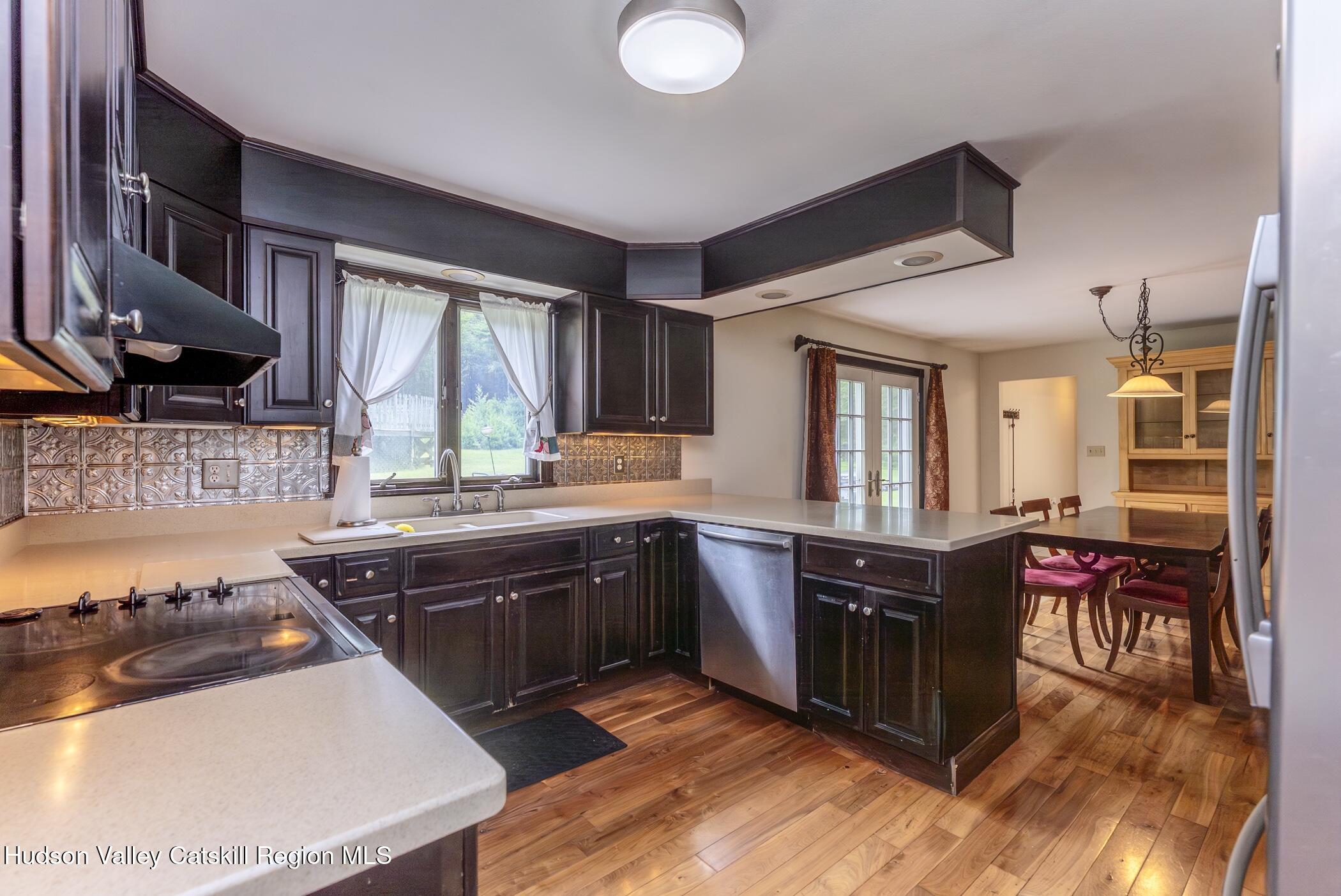 137 Bush Road Stone Ridge, NY 12484 - Photo 15 of 39 a kitchen with stainless steel appliances granite countertop a stove and a sink