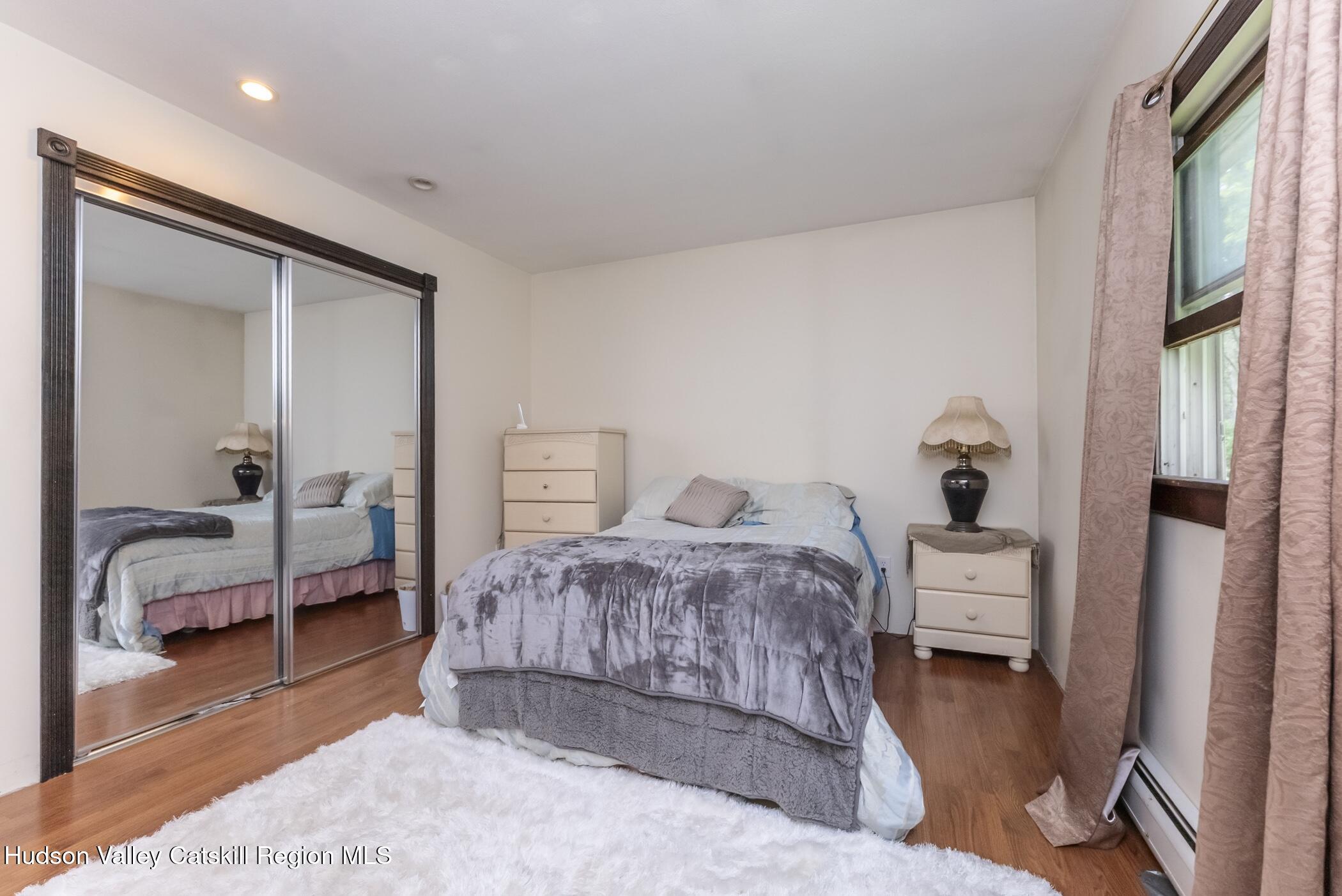 137 Bush Road Stone Ridge, NY 12484 - Photo 22 of 39 a bedroom with a bed and a couch