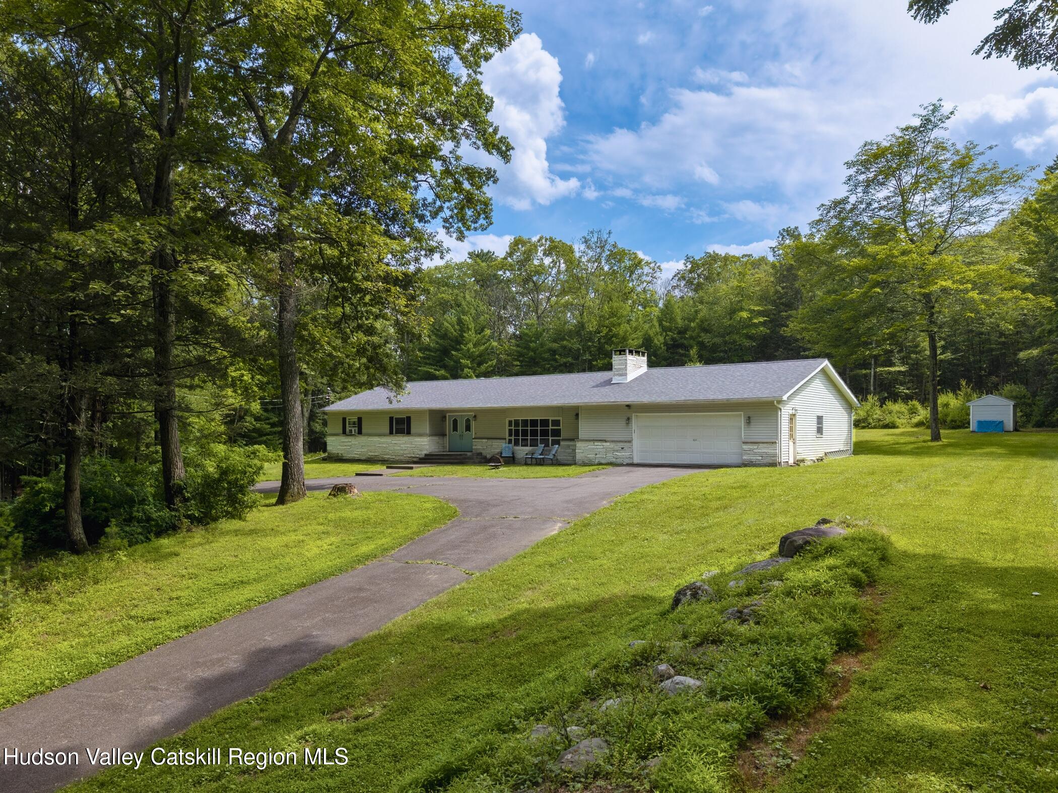 137 Bush Road Stone Ridge, NY 12484 - Photo 27 of 39 a front view of a house with garden