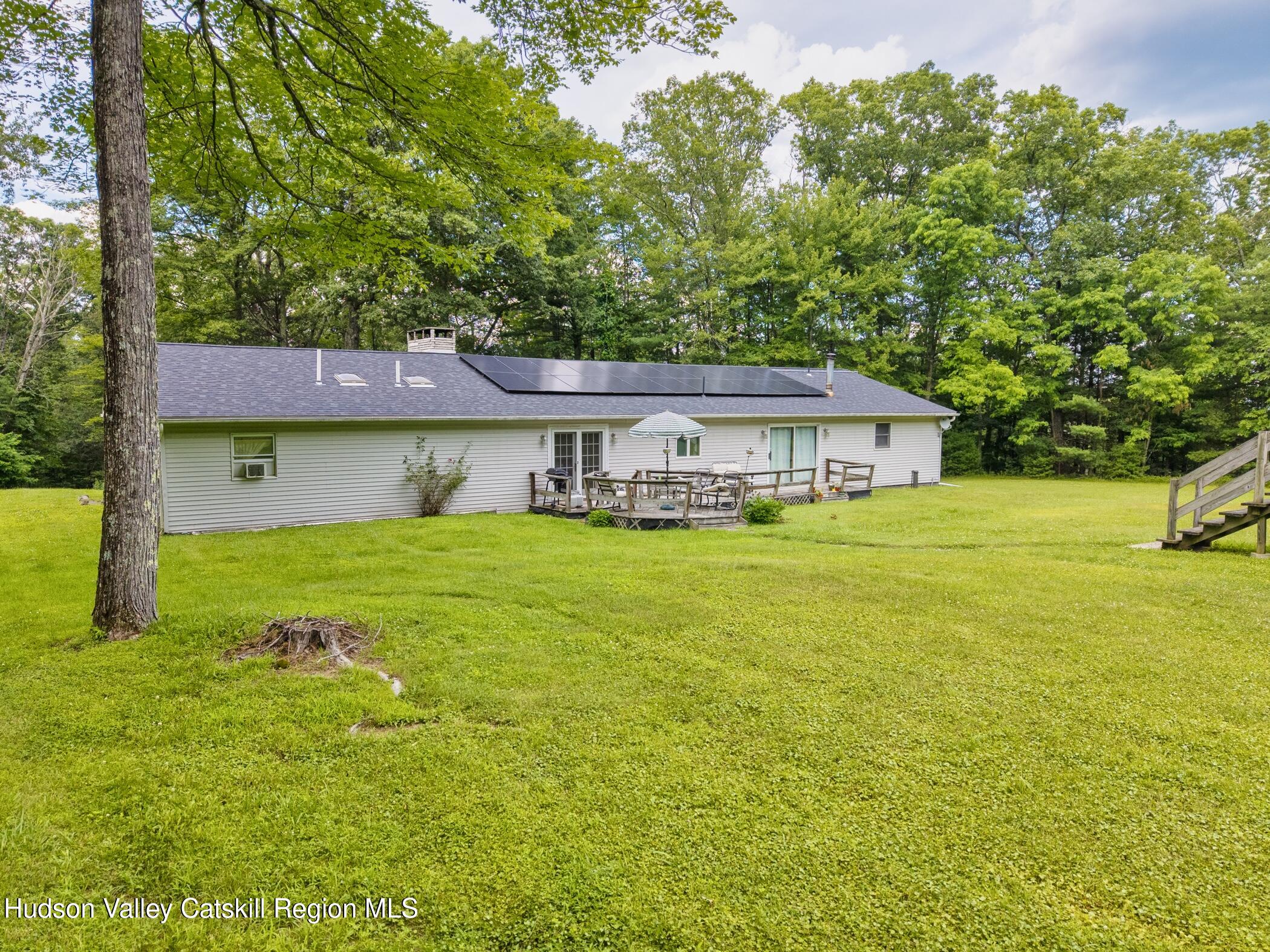 137 Bush Road Stone Ridge, NY 12484 - Photo 29 of 39 a house view with swimming pool in front of it