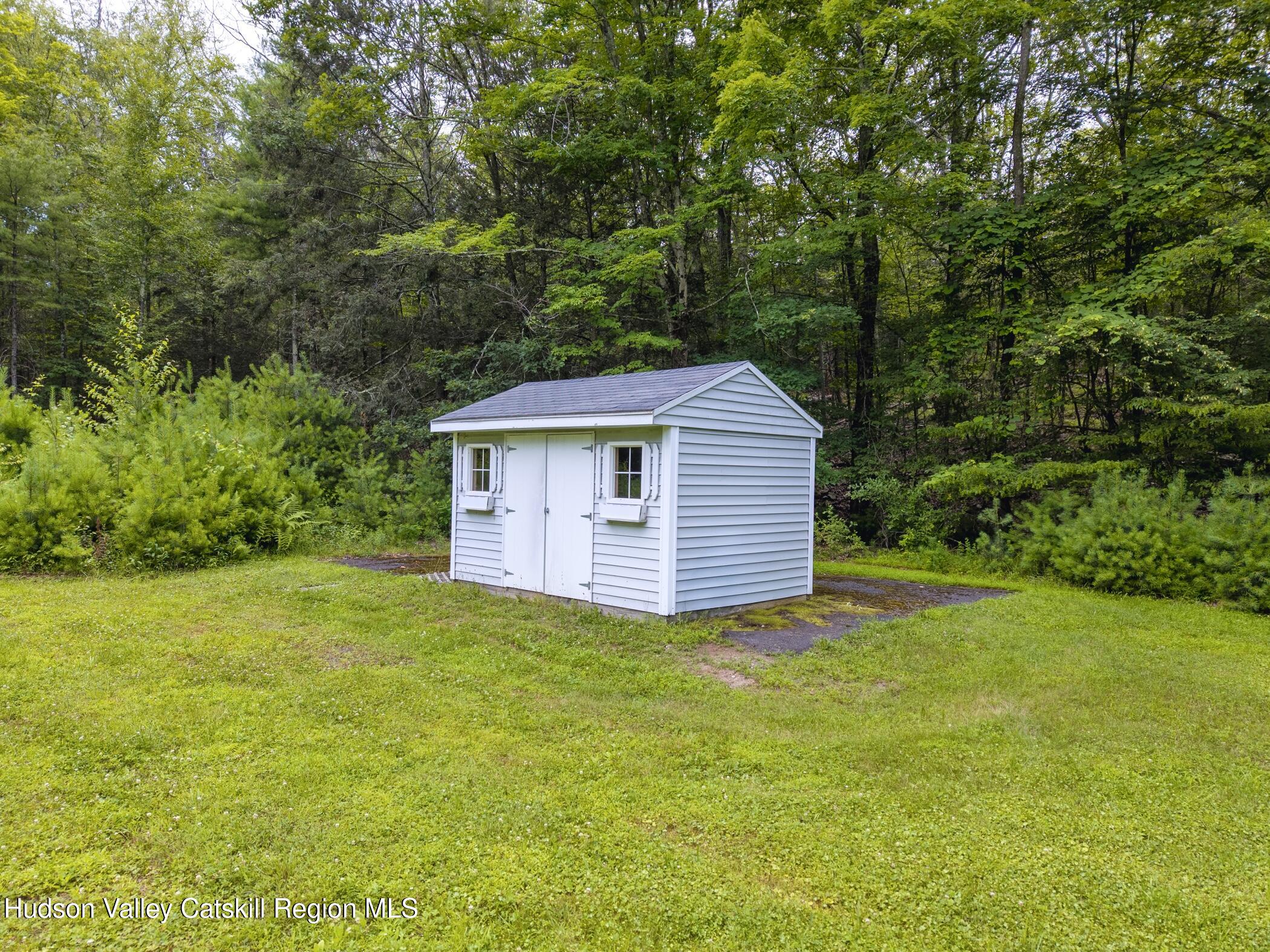 137 Bush Road Stone Ridge, NY 12484 - Photo 34 of 39 a view of a big yard with plants and large trees