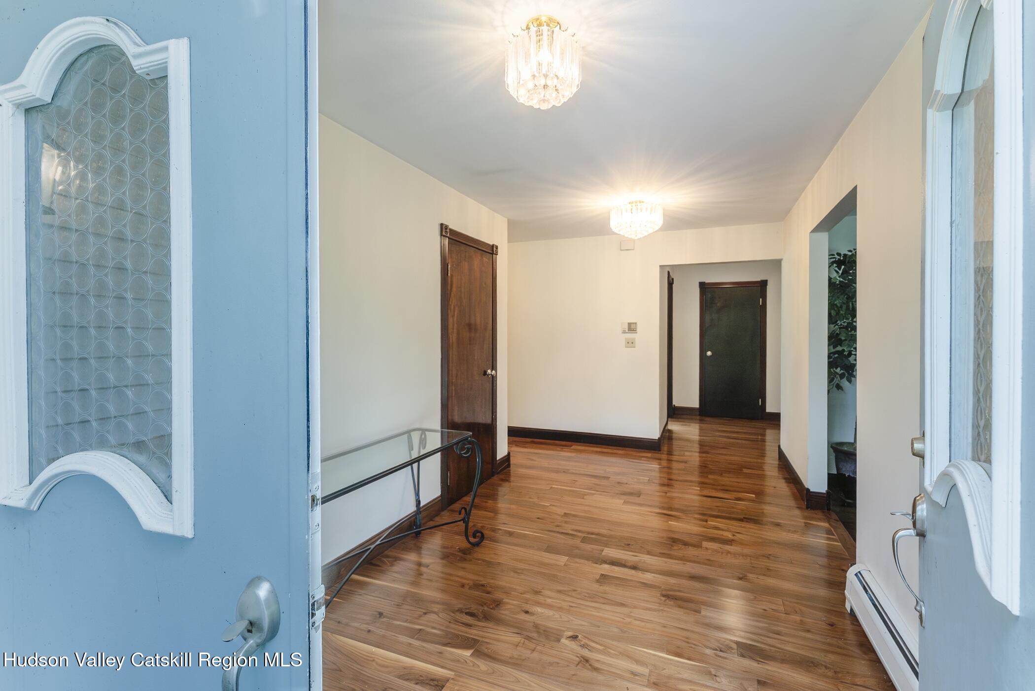 137 Bush Road Stone Ridge, NY 12484 - Photo 4 of 39 a view of a hallway with wooden floor