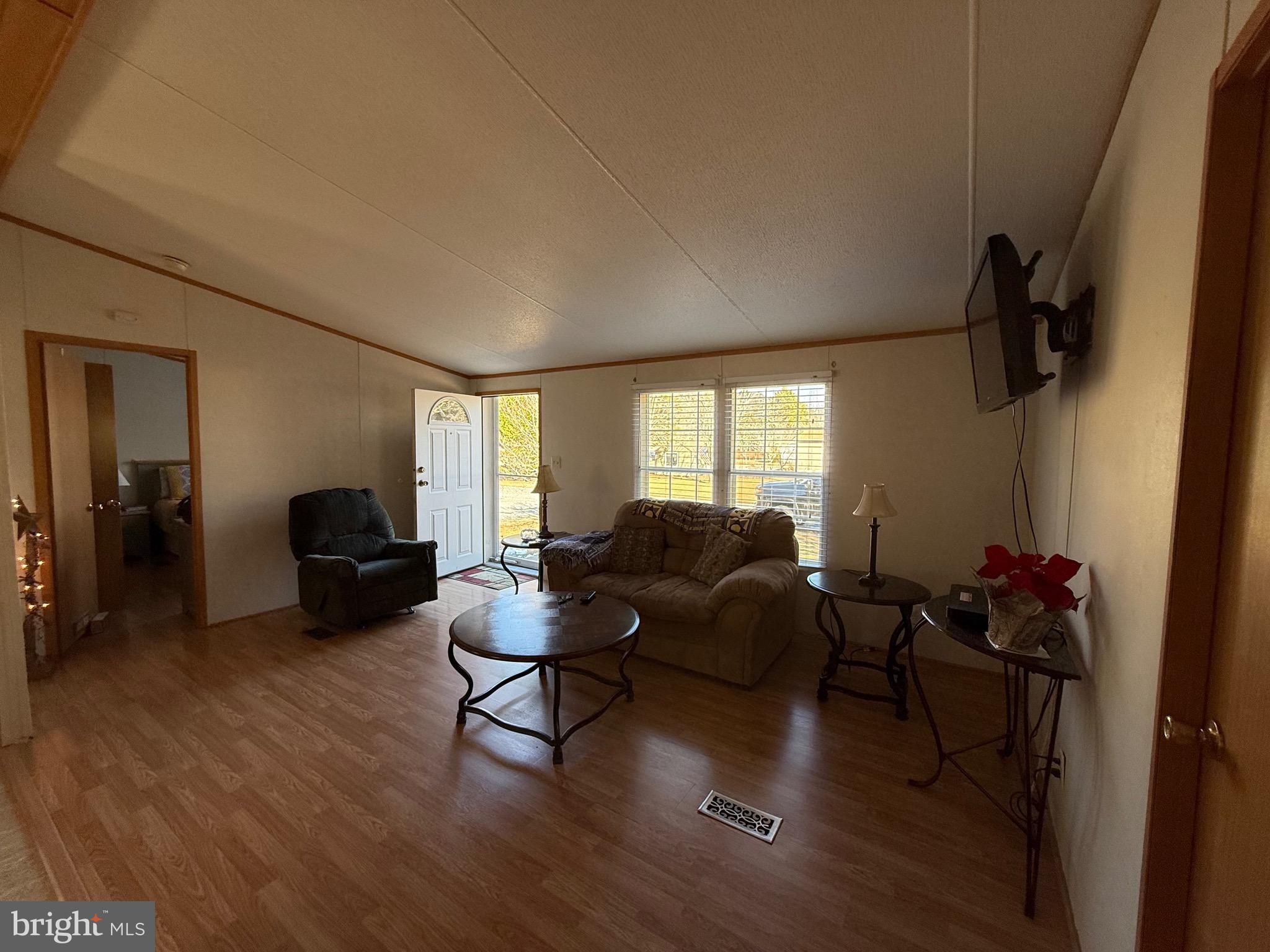 10323 Henry Road Berlin, MD 21811 - Photo 11 of 19 a living room with furniture and a window
