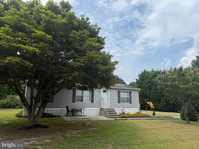 a house with river in front of it