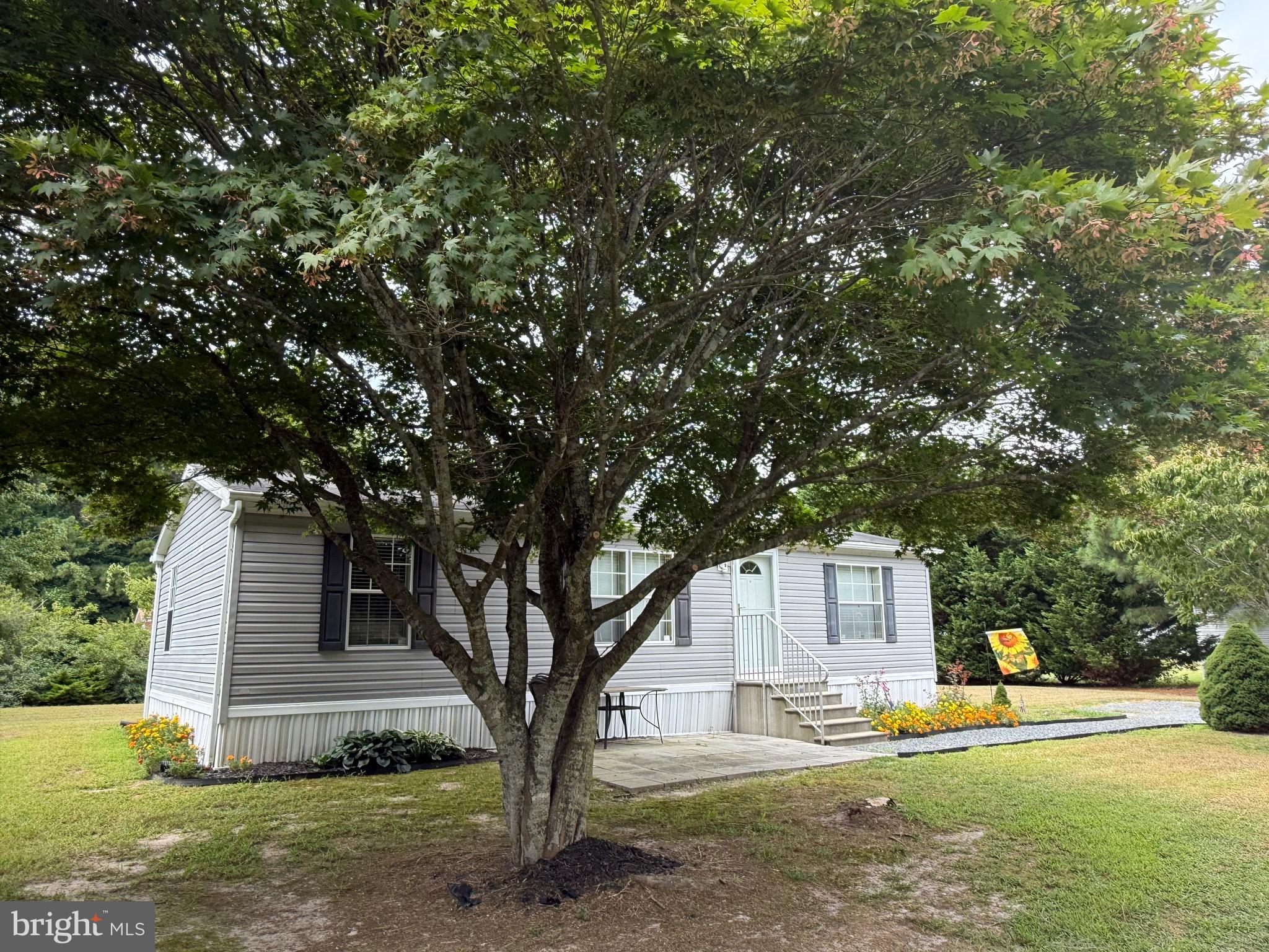 10323 Henry Road Berlin, MD 21811 - Photo 7 of 19 a house with trees in the background