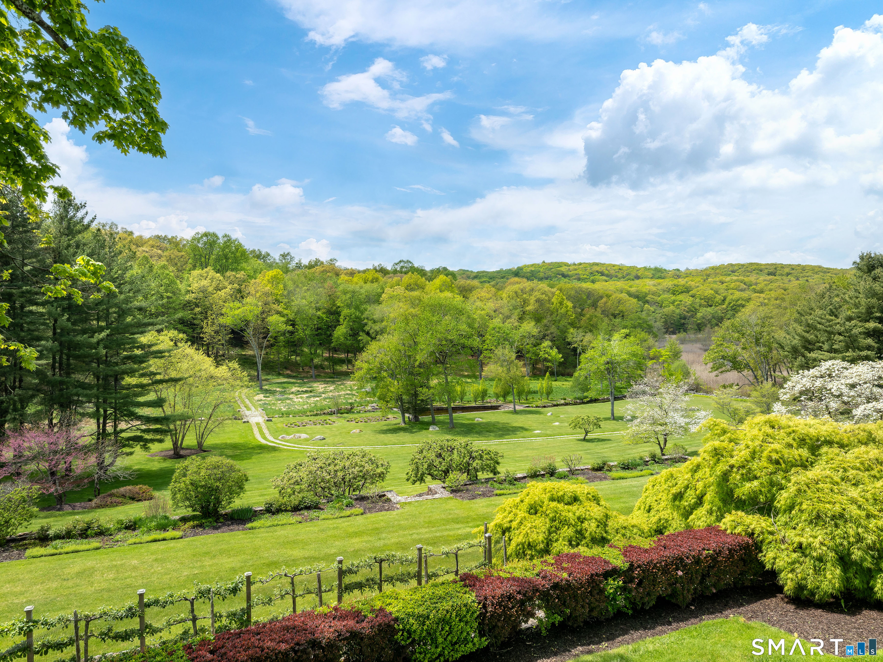 155 Long Ridge Road Danbury, CT 06810 - Photo 7 of 40 The long view from the house captures one of the defining qualities of the estate: privacy, scale, and open landscape in every direction.