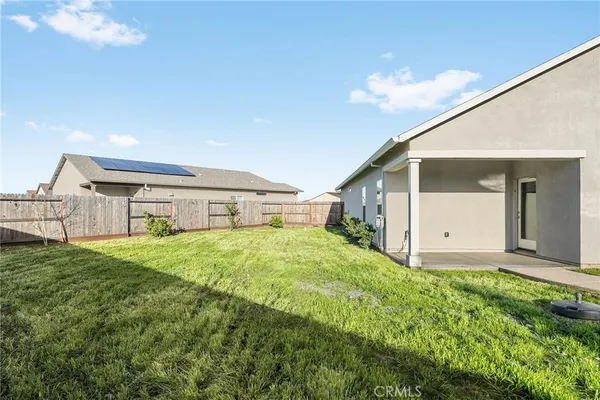 a house view with a backyard space