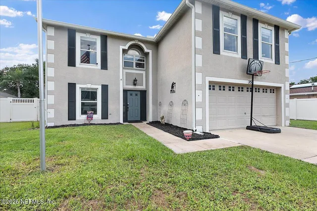 a view of a backyard of the house