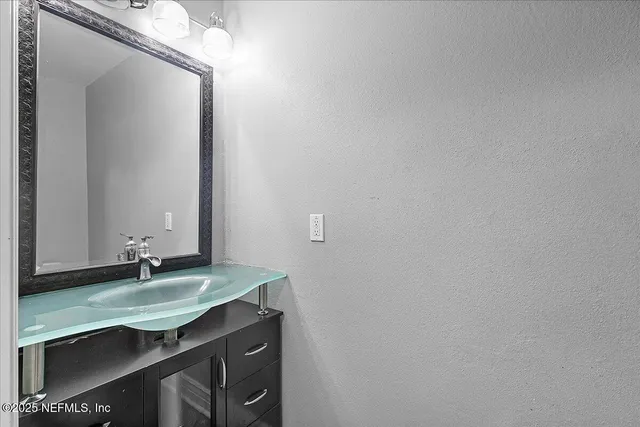 a sink with a mirror