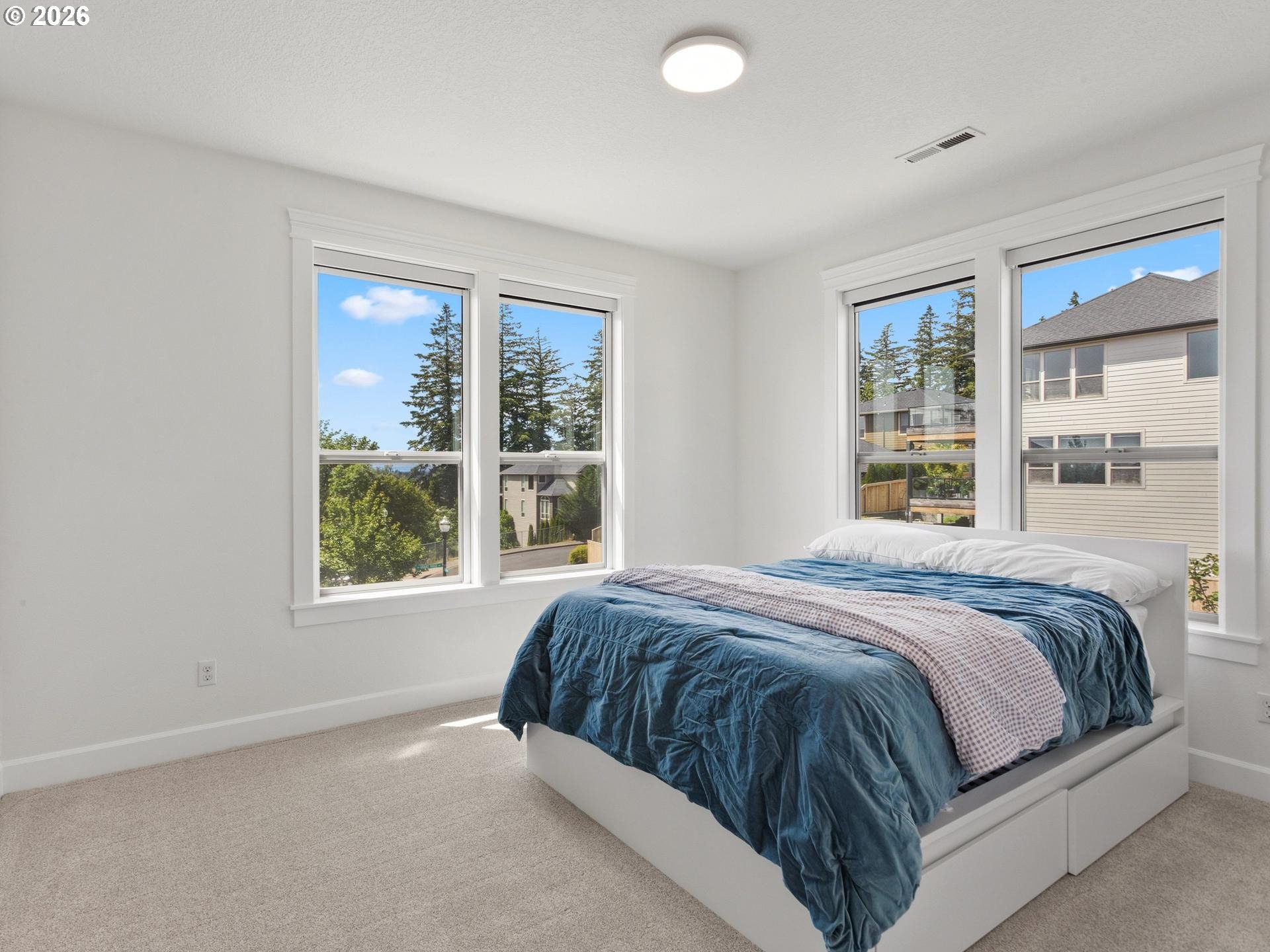 1012 Northwest Goodwin Street Camas, WA 98607 - Photo 27 of 44 a bedroom with a large bed and a window