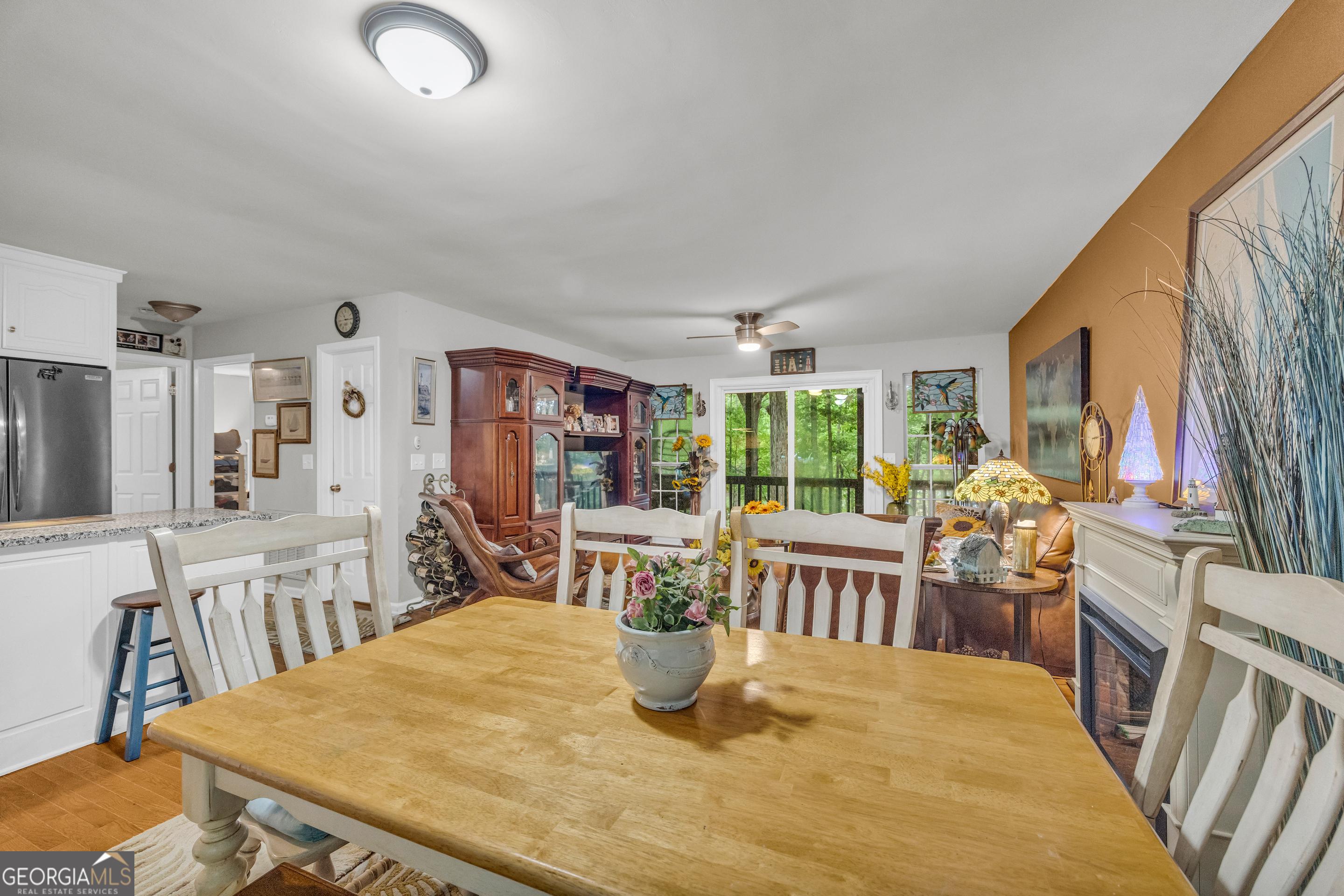 26 Chief Lane Hartwell, GA 30643 - Photo 16 of 65 a dining room with furniture a rug and wooden floor