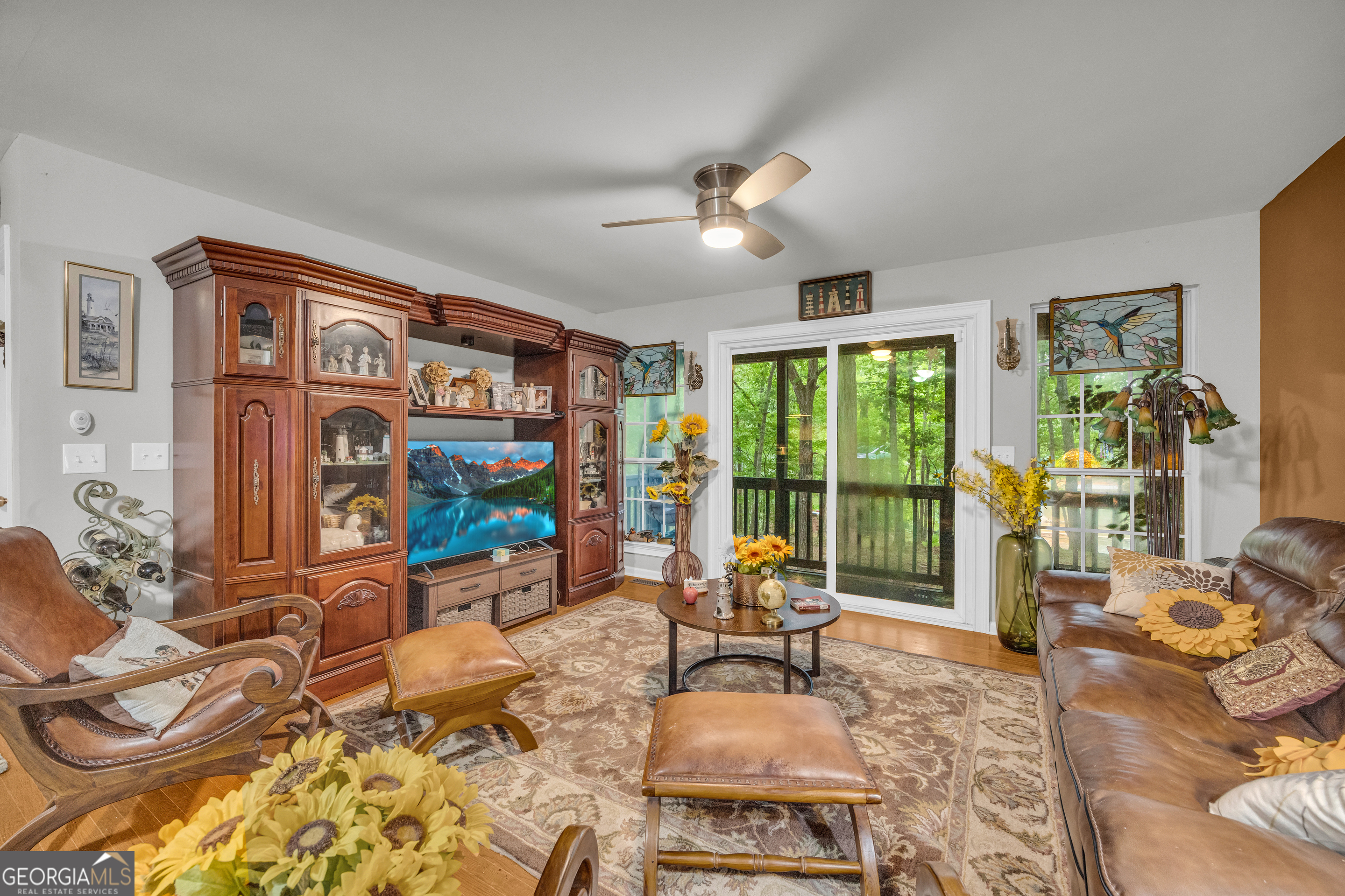 26 Chief Lane Hartwell, GA 30643 - Photo 18 of 65 a living room with furniture large window and flat screen tv