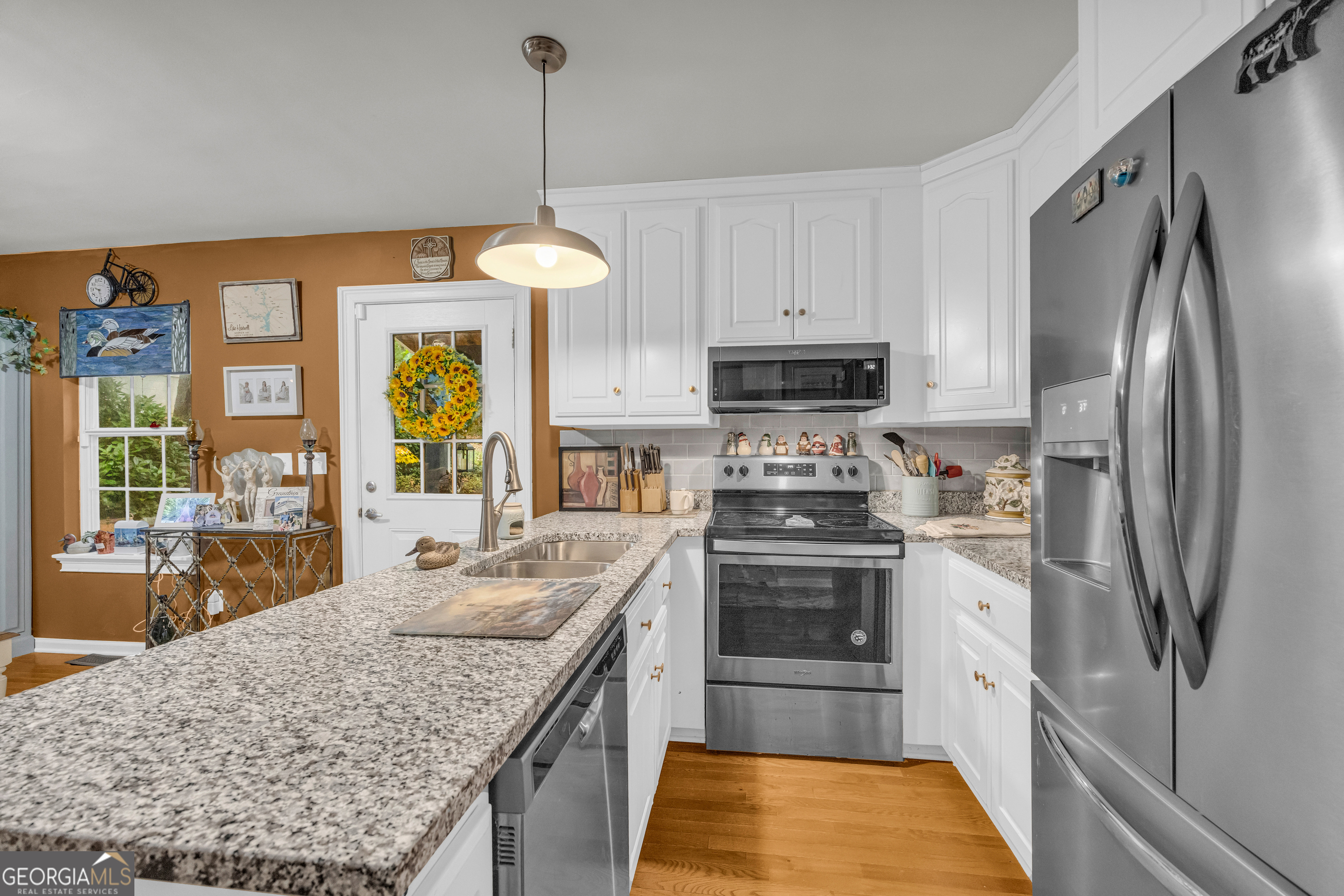 26 Chief Lane Hartwell, GA 30643 - Photo 22 of 65 a kitchen with stainless steel appliances granite countertop a refrigerator a oven and a sink