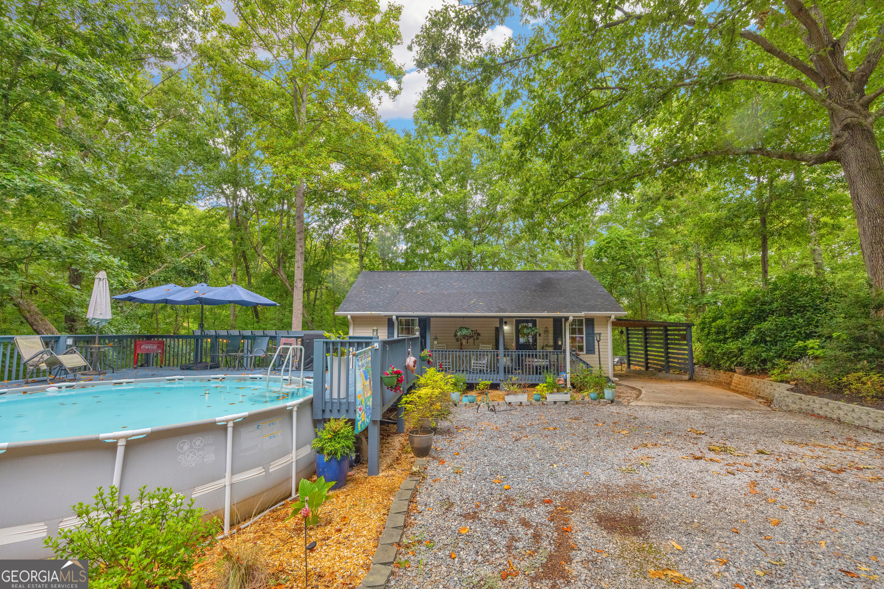 26 Chief Lane Hartwell, GA 30643 - Photo 4 of 65 a view of a patio with chairs and a small yard