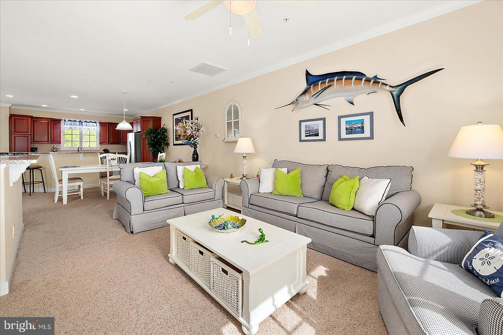 9823 Golf Course Road, Unit 7 Ocean City, MD 21842 - Photo 13 of 76 a living room with furniture and a couch