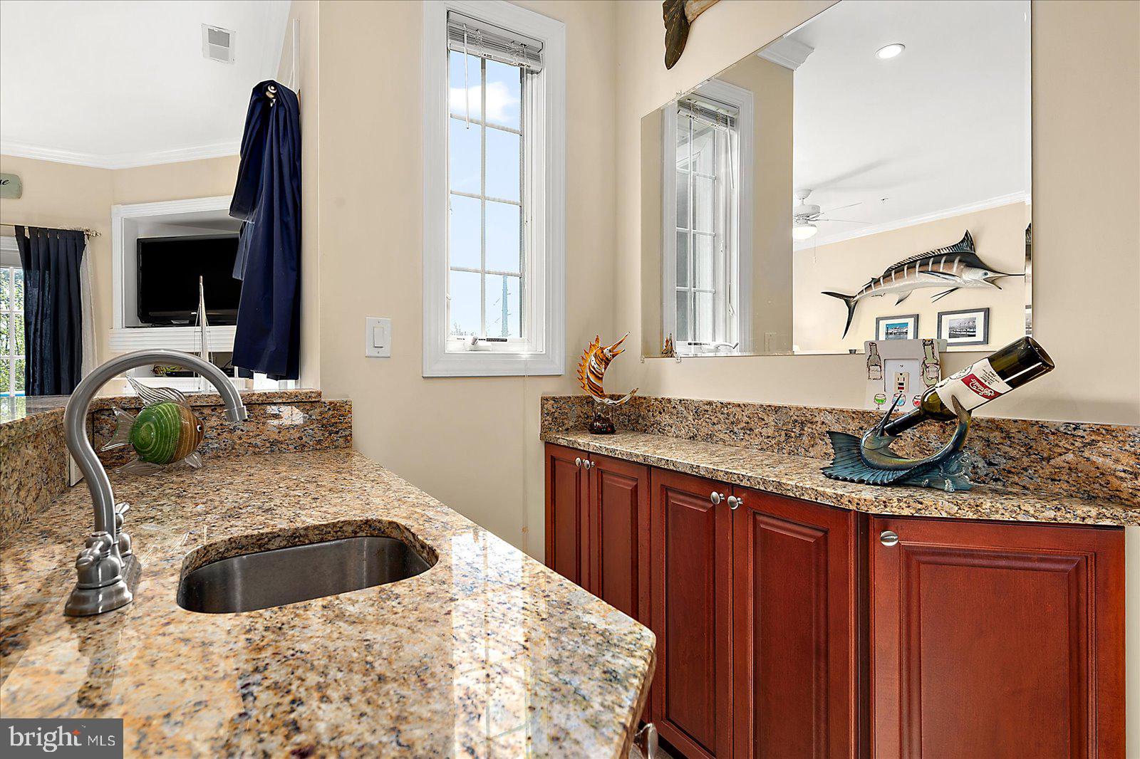 9823 Golf Course Road, Unit 7 Ocean City, MD 21842 - Photo 17 of 76 a kitchen with a sink and a window