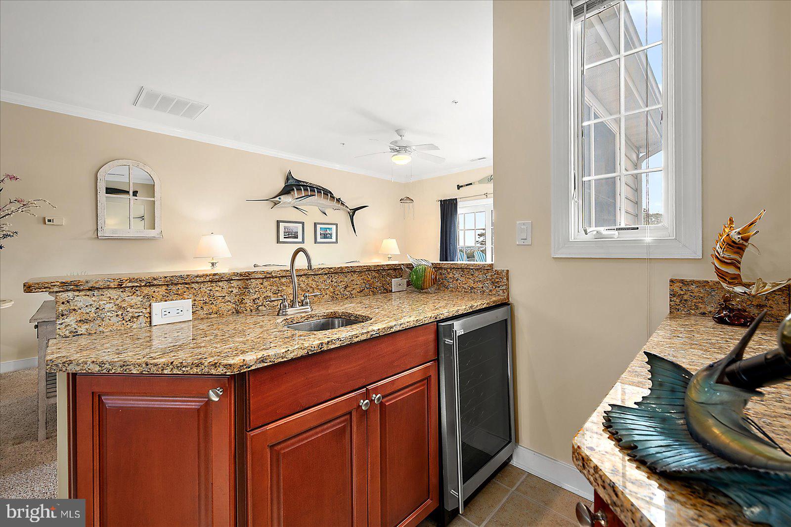 9823 Golf Course Road, Unit 7 Ocean City, MD 21842 - Photo 18 of 76 a bathroom with a granite countertop sink and a mirror