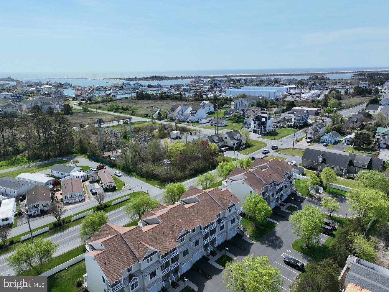 9823 Golf Course Road, Unit 7 Ocean City, MD 21842 - Photo 2 of 76 an aerial view of a house with a garden