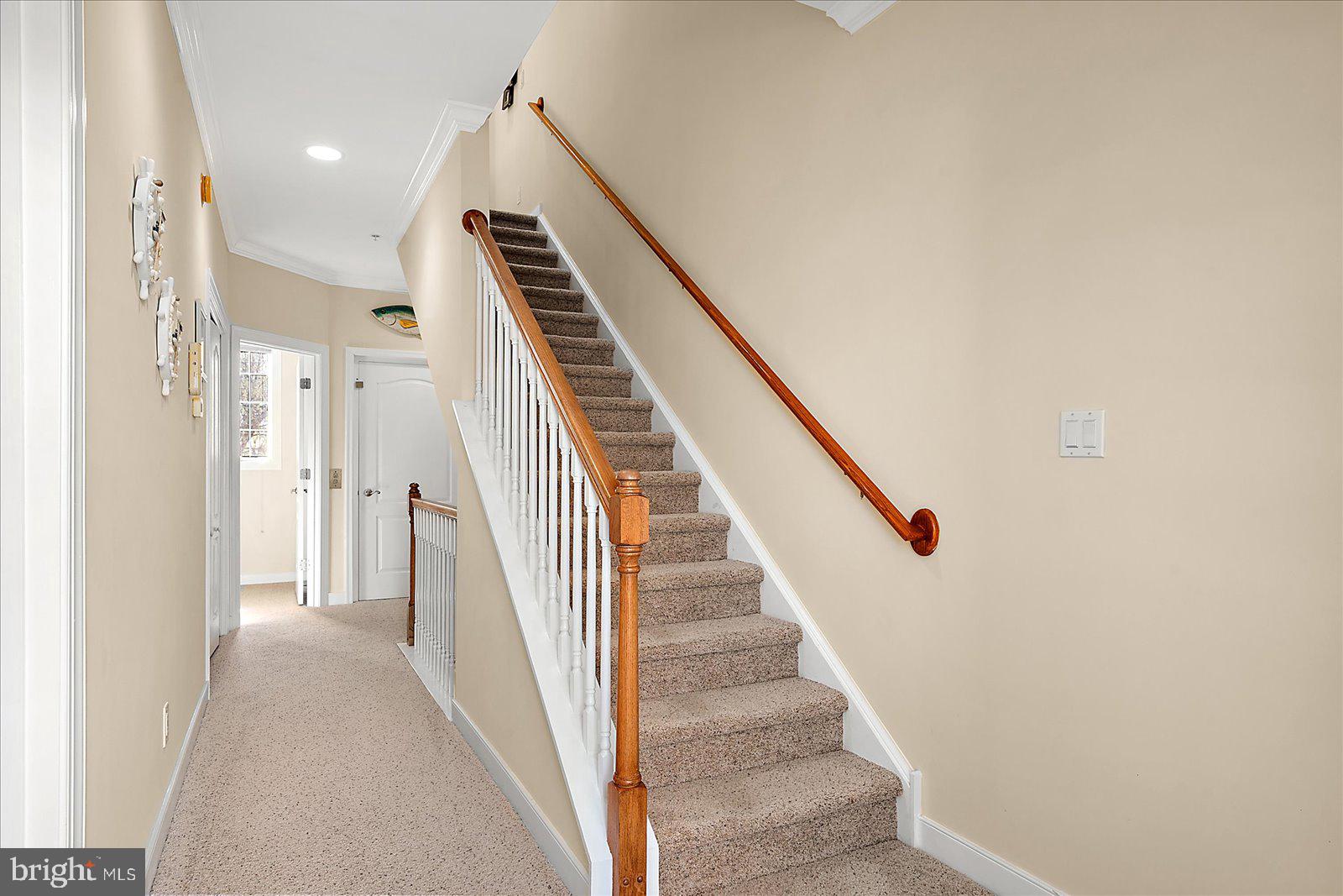 9823 Golf Course Road, Unit 7 Ocean City, MD 21842 - Photo 28 of 76 a view of a hallway with staircase