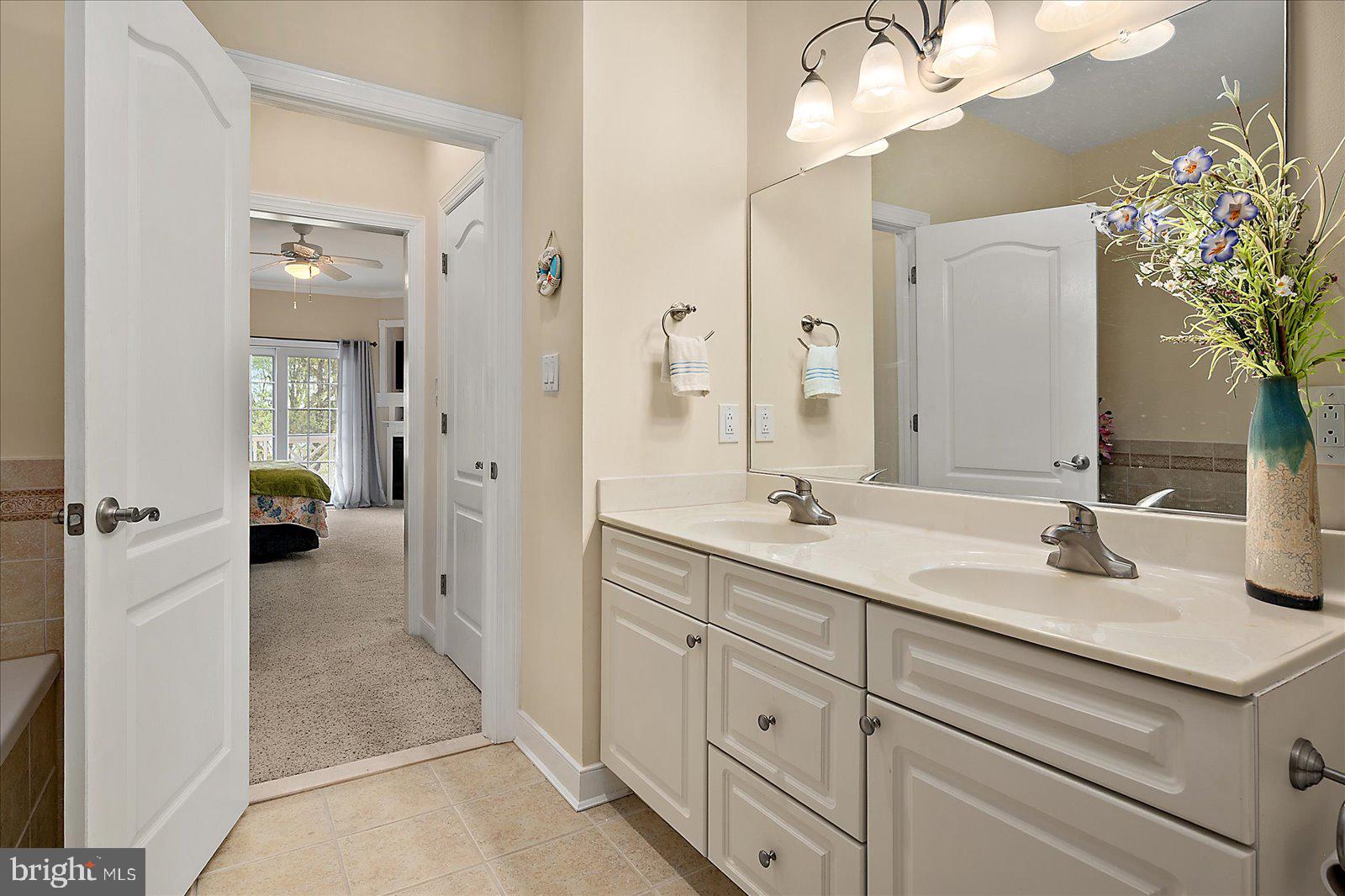 9823 Golf Course Road, Unit 7 Ocean City, MD 21842 - Photo 34 of 76 a bathroom with a sink and a mirror