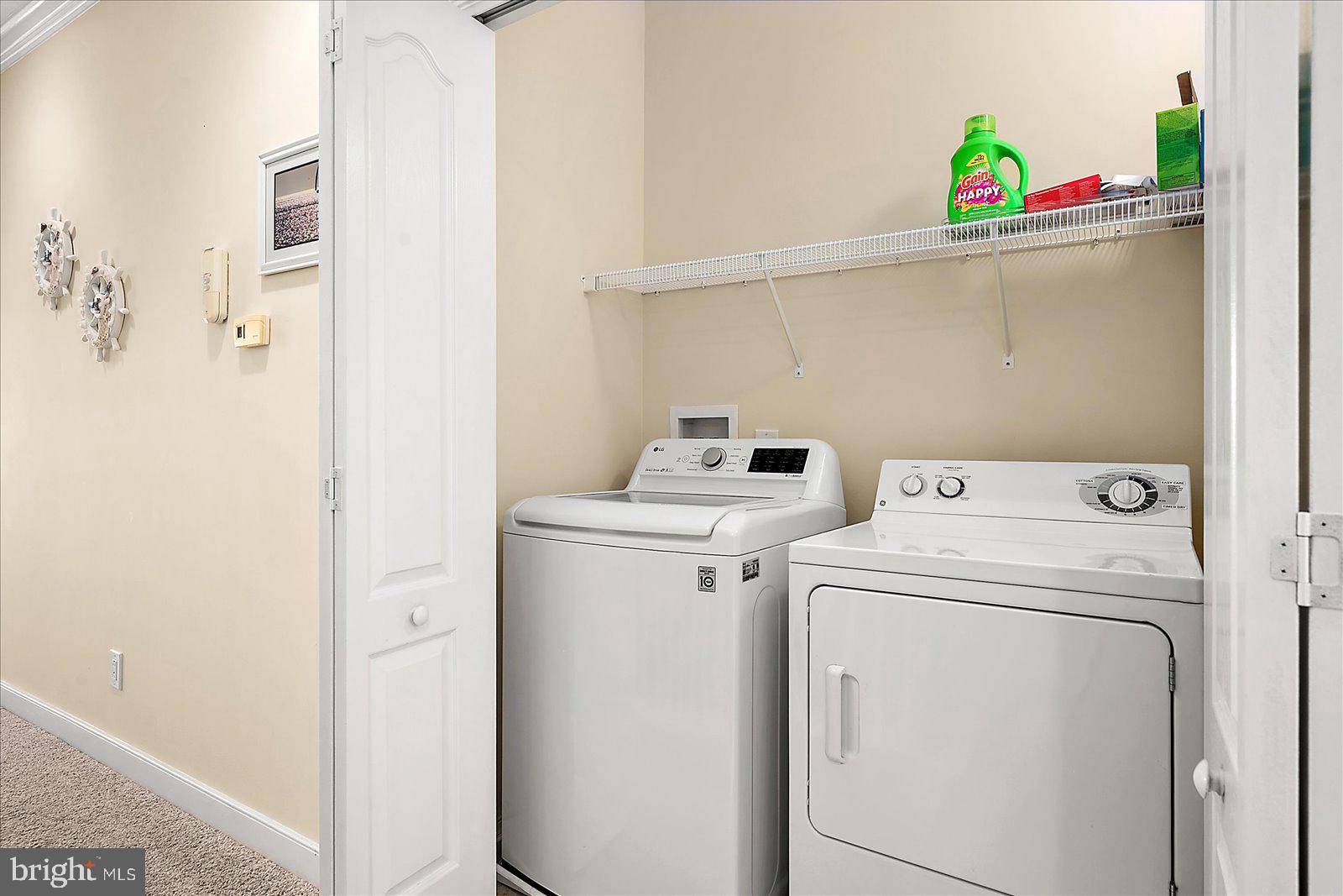 9823 Golf Course Road, Unit 7 Ocean City, MD 21842 - Photo 47 of 76 a utility room with dryer and washer