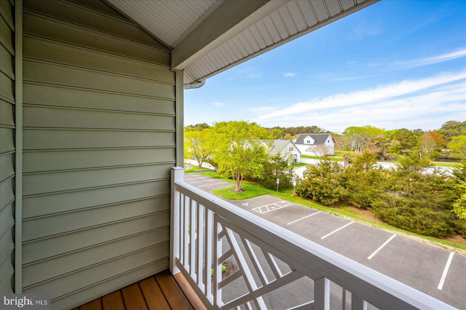 9823 Golf Course Road, Unit 7 Ocean City, MD 21842 - Photo 48 of 76 a view of a balcony with an ocean from a balcony