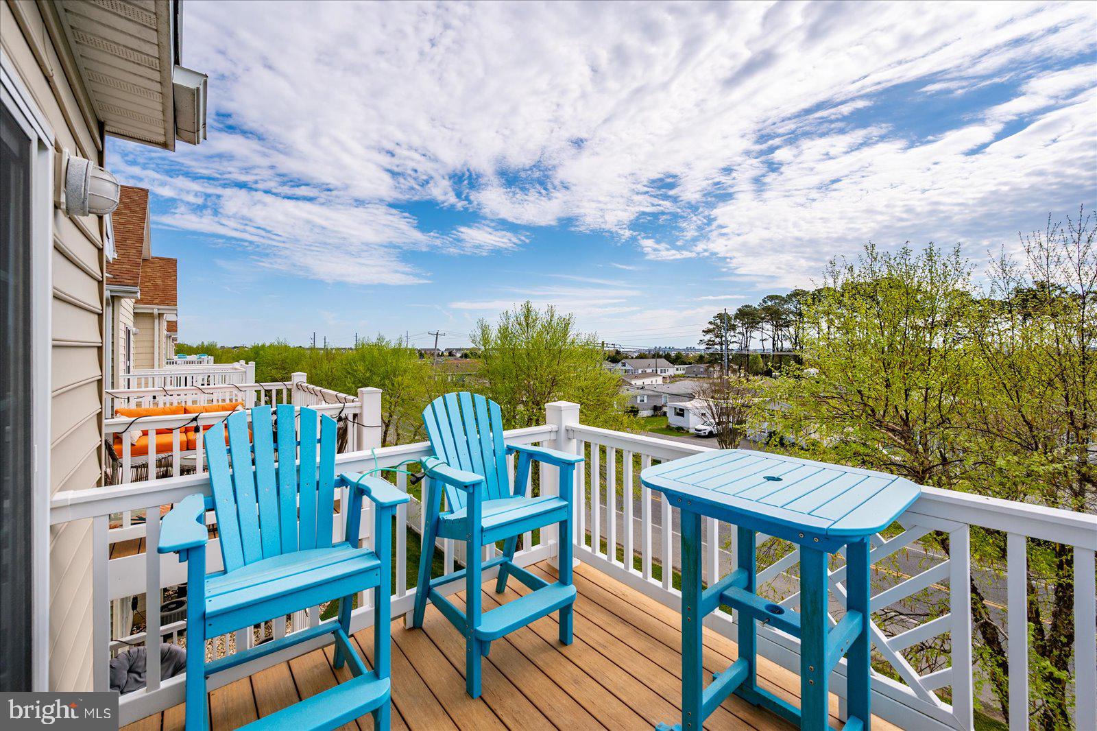 9823 Golf Course Road, Unit 7 Ocean City, MD 21842 - Photo 50 of 76 a view of a chairs and table on the terrace