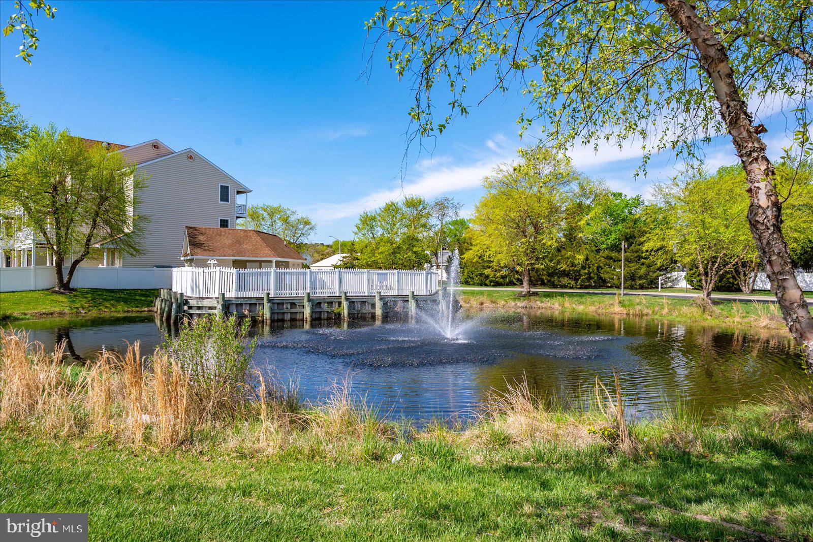 9823 Golf Course Road, Unit 7 Ocean City, MD 21842 - Photo 58 of 76 a view of a lake with houses