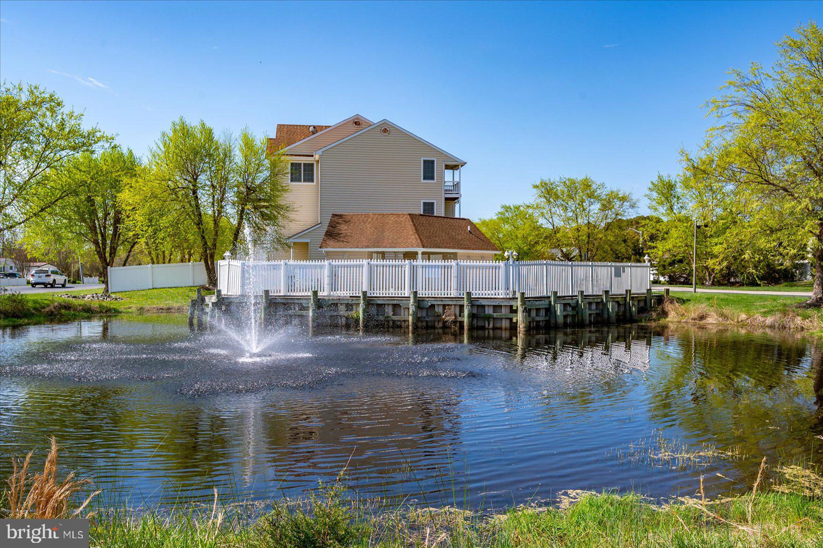 9823 Golf Course Road, Unit 7 Ocean City, MD 21842 - Photo 59 of 76 a view of a lake with house