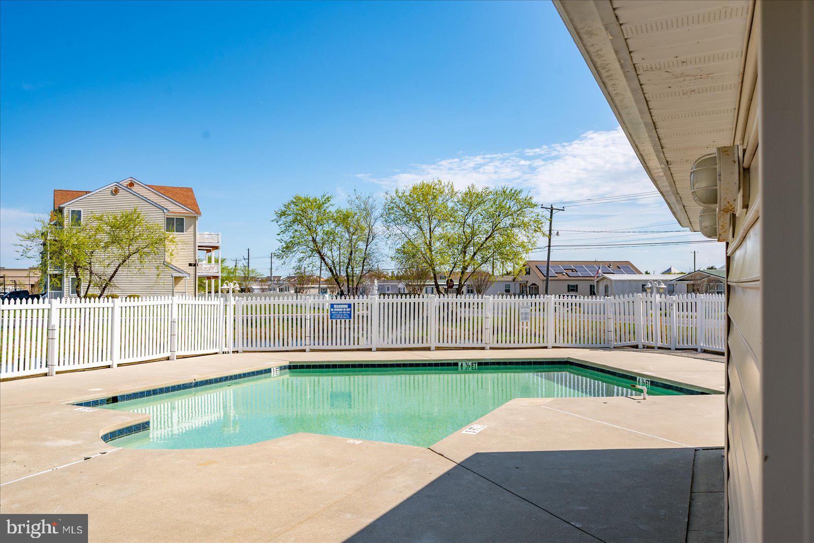 9823 Golf Course Road, Unit 7 Ocean City, MD 21842 - Photo 61 of 76 a view of swimming pool with a yard